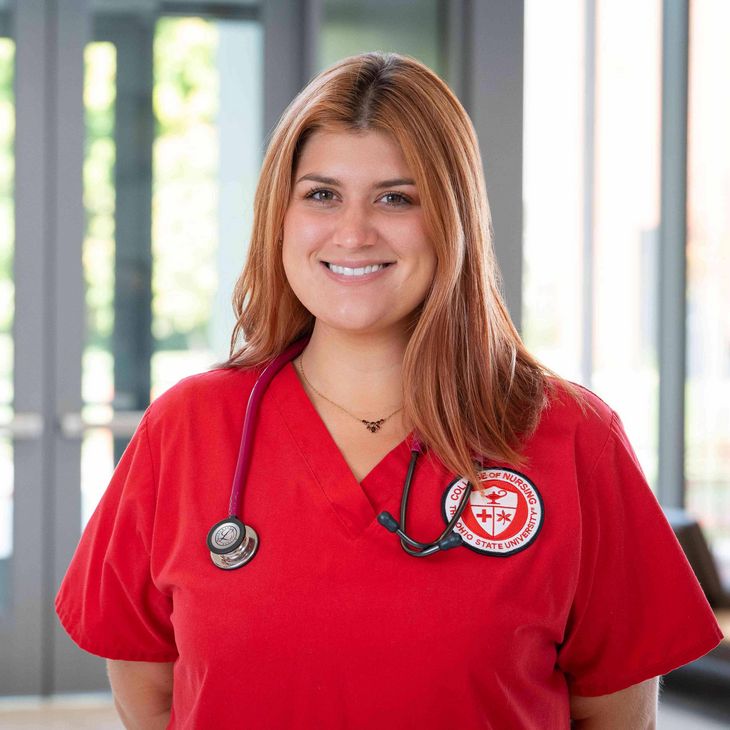 nursing student in red scrubs