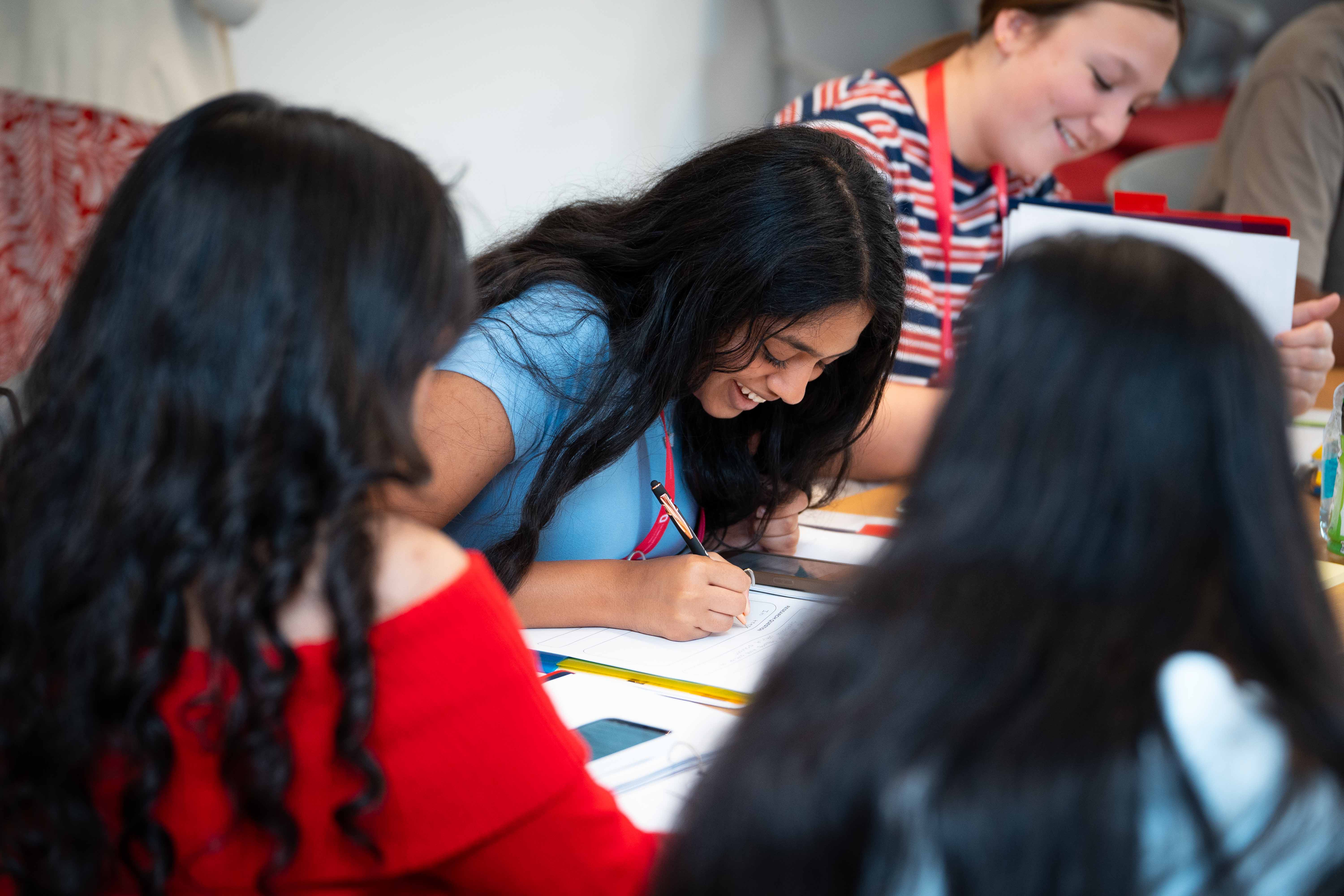 young adults collaborating at summer research camp