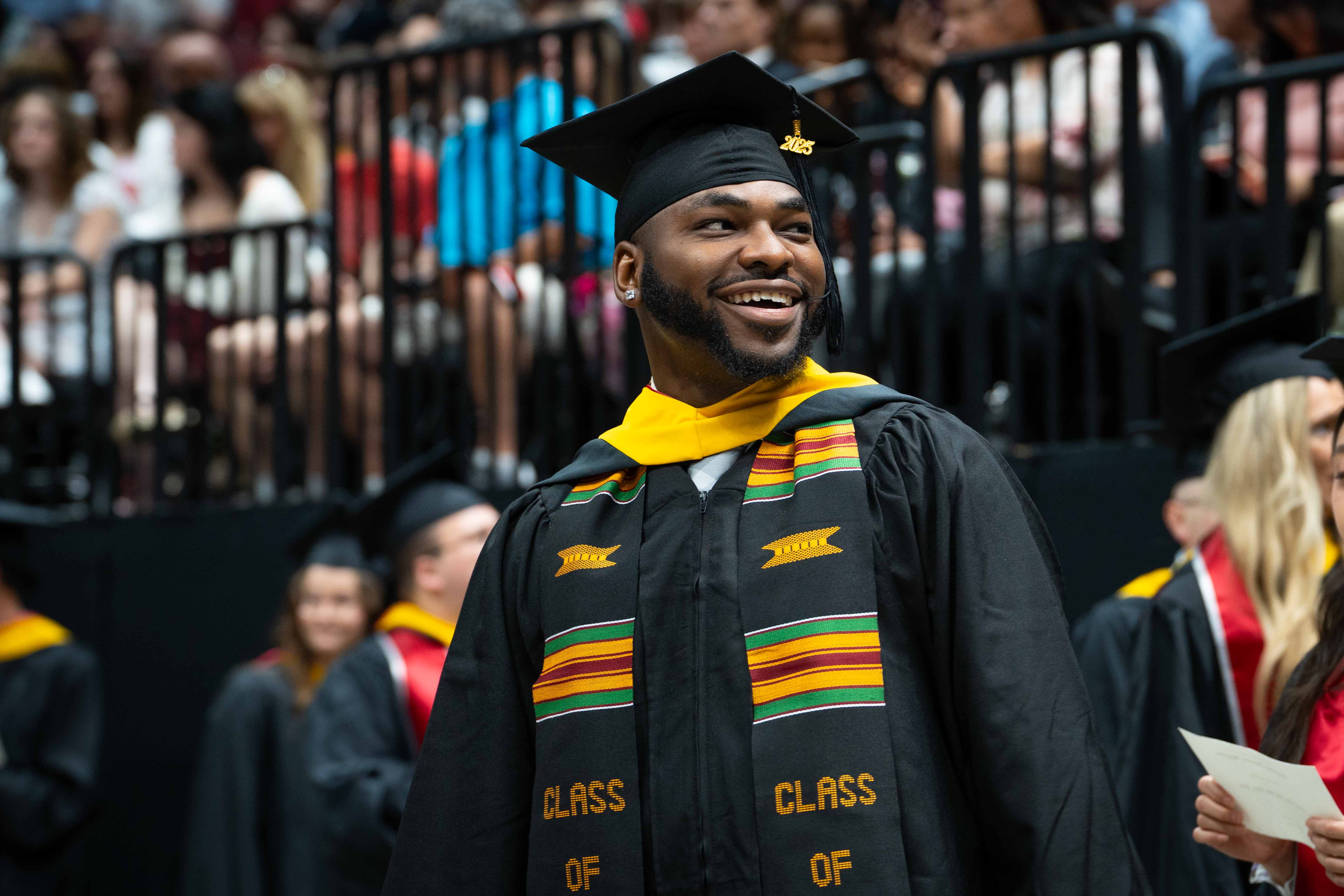 student walking at convocation