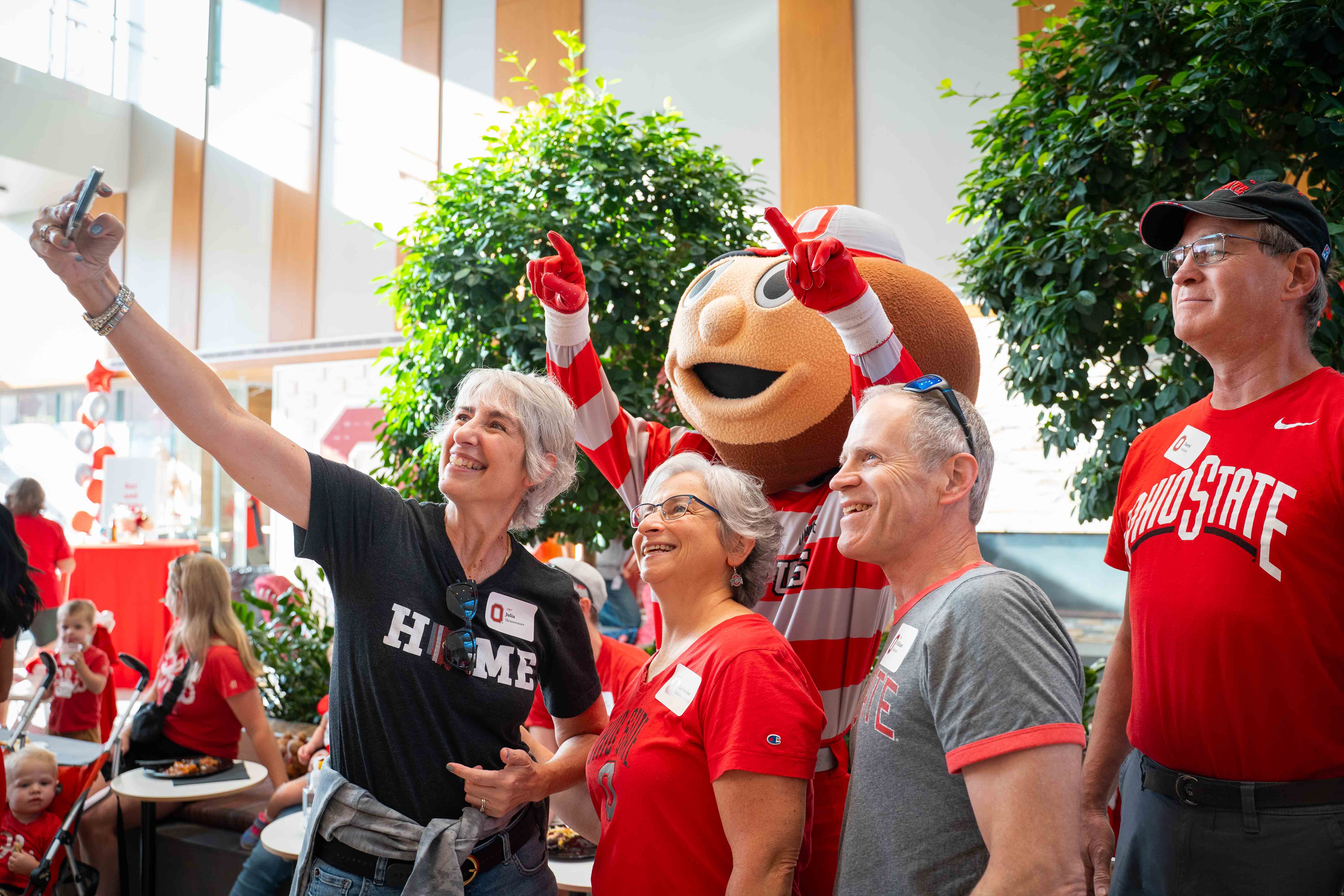 group of alumni taking a selfie with Brutus