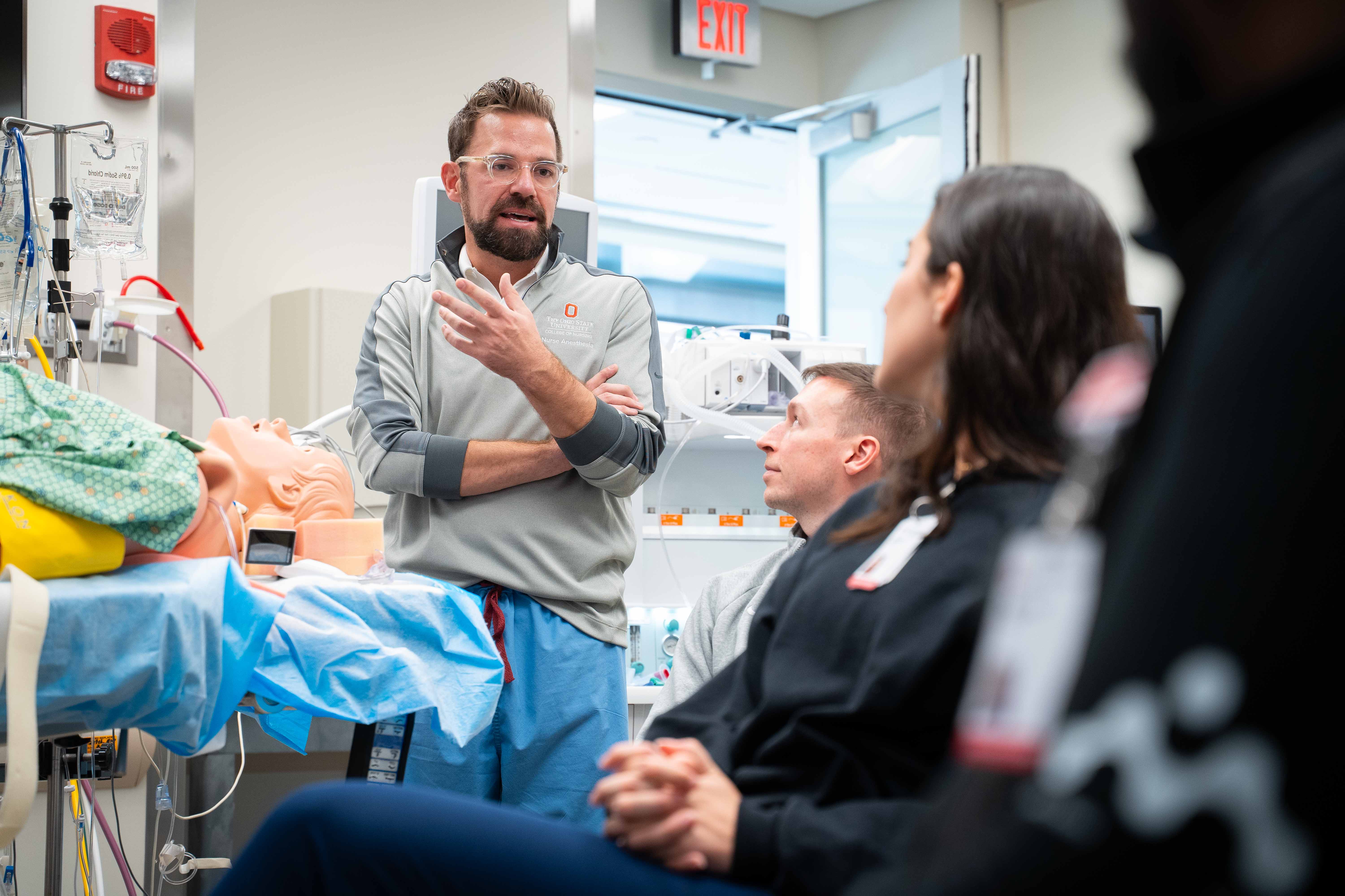 John Welch instructing CRNA students in clinical setting