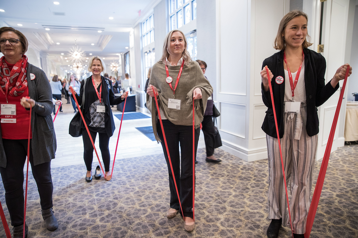 EBP Summit attendees participating in exercise band activity