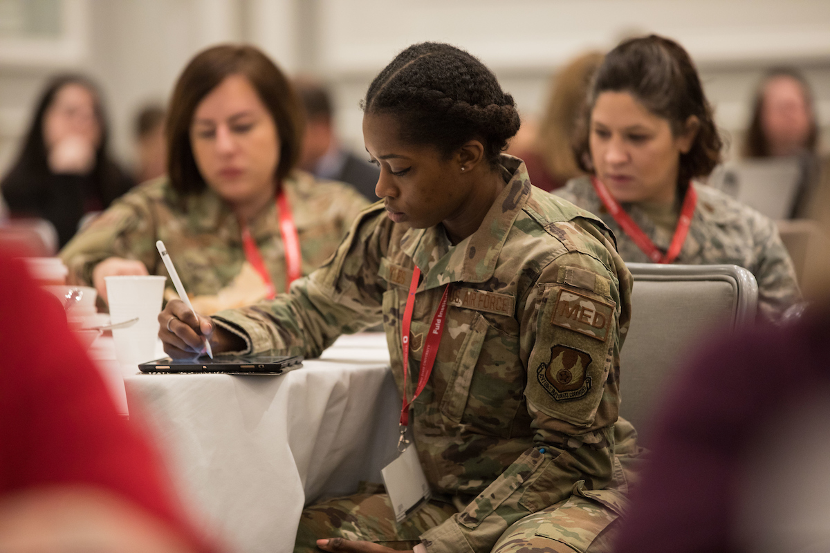 EBP Summit attendee in military attire