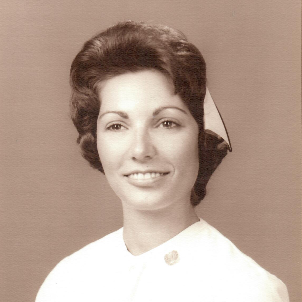 Sandy in her new white uniform for graduation, 1965