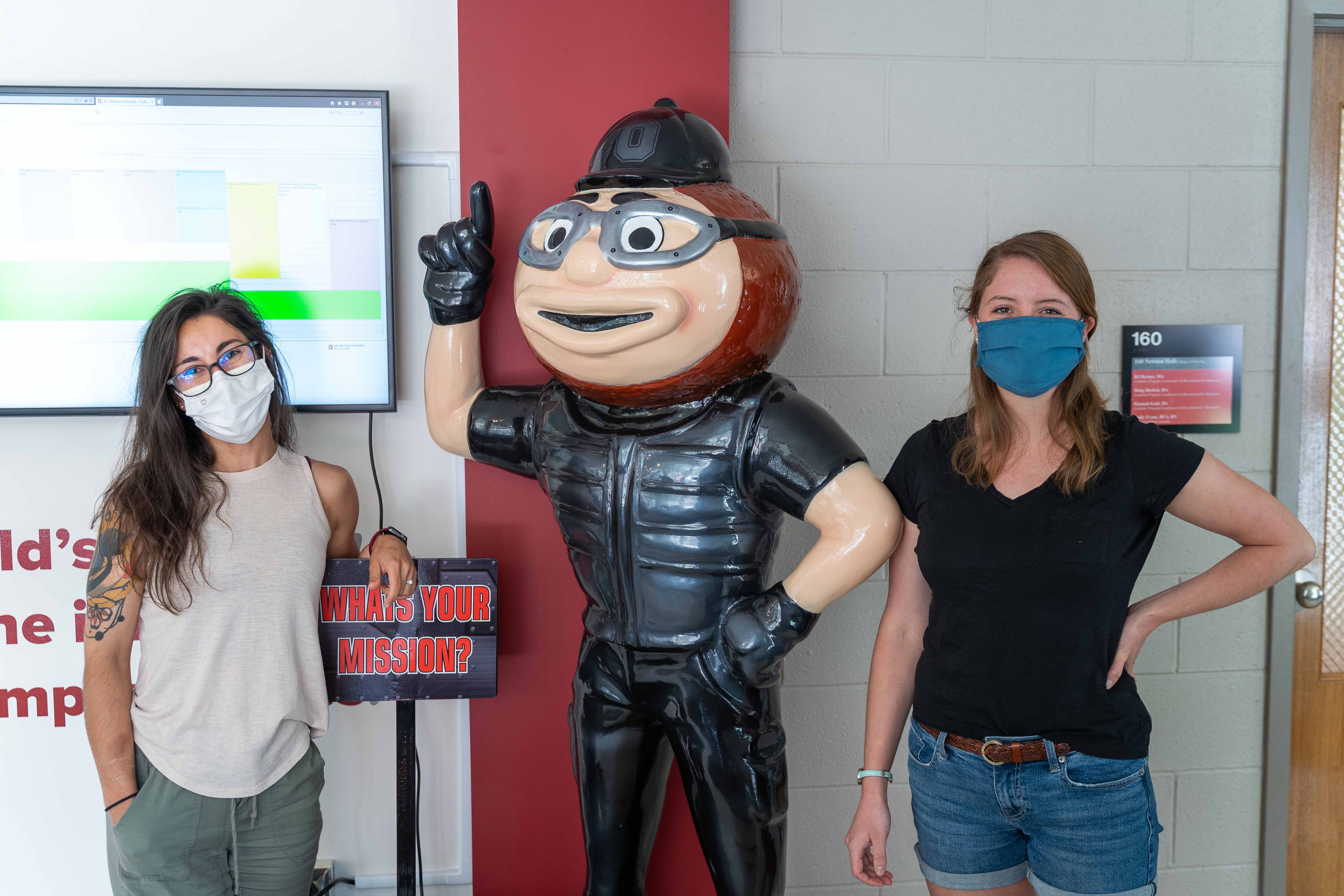 Alyssa Wenger and Amy Dennis posing with Mission Impossible Brutus