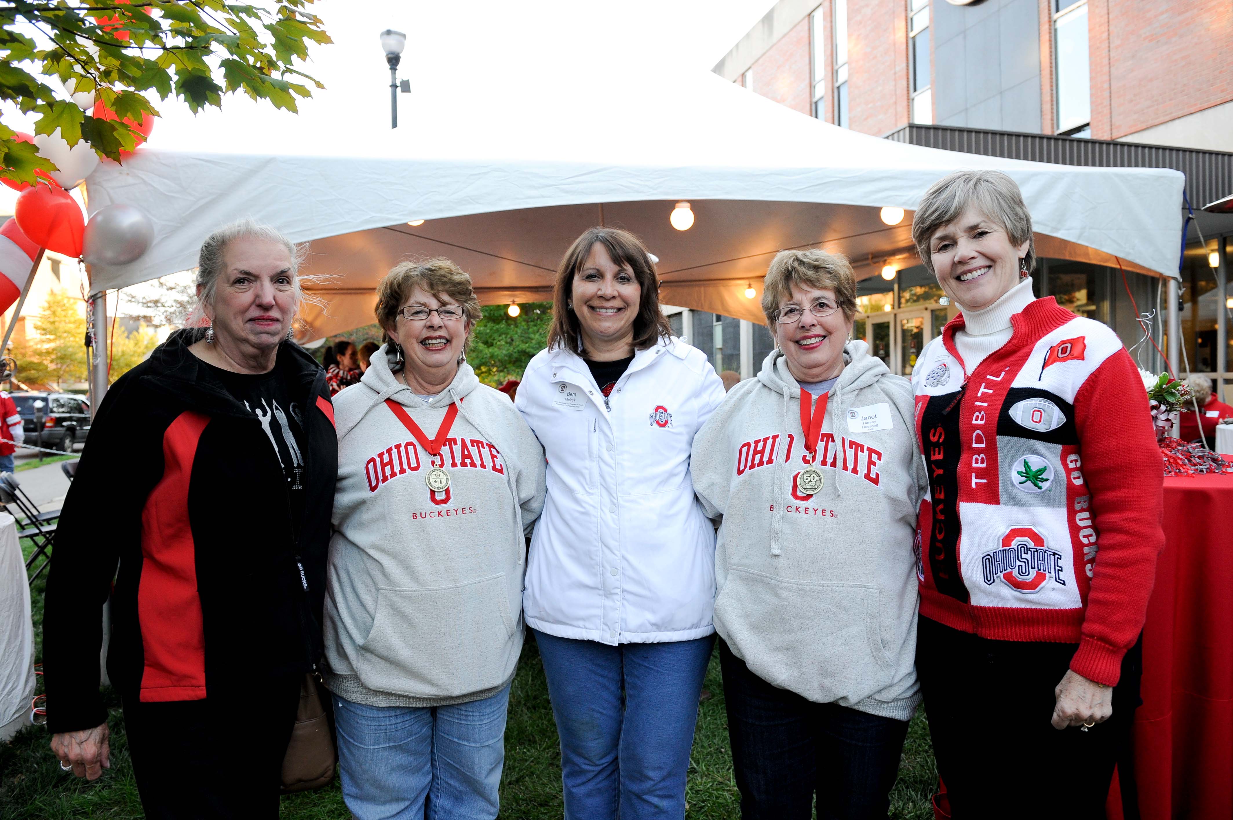 Margaret Graham poses with alumni and friends at Homecoming