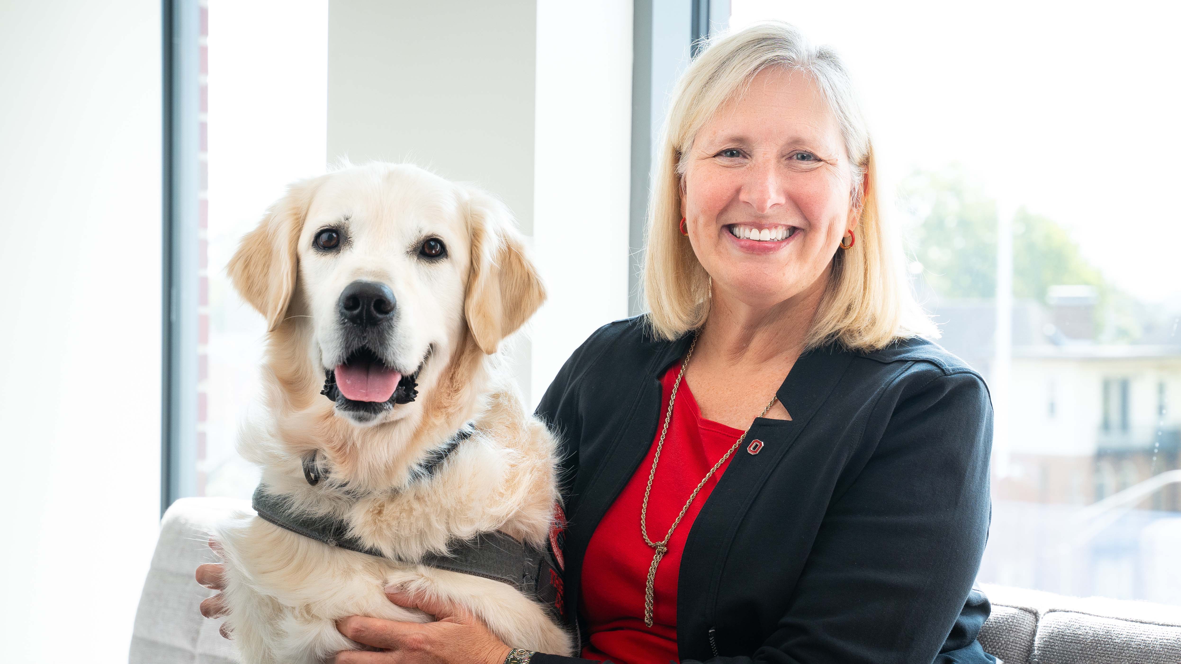 Rose in the dean’s suite in Jane E. Heminger Hall with Buckeye Paws service dog, Shiloh