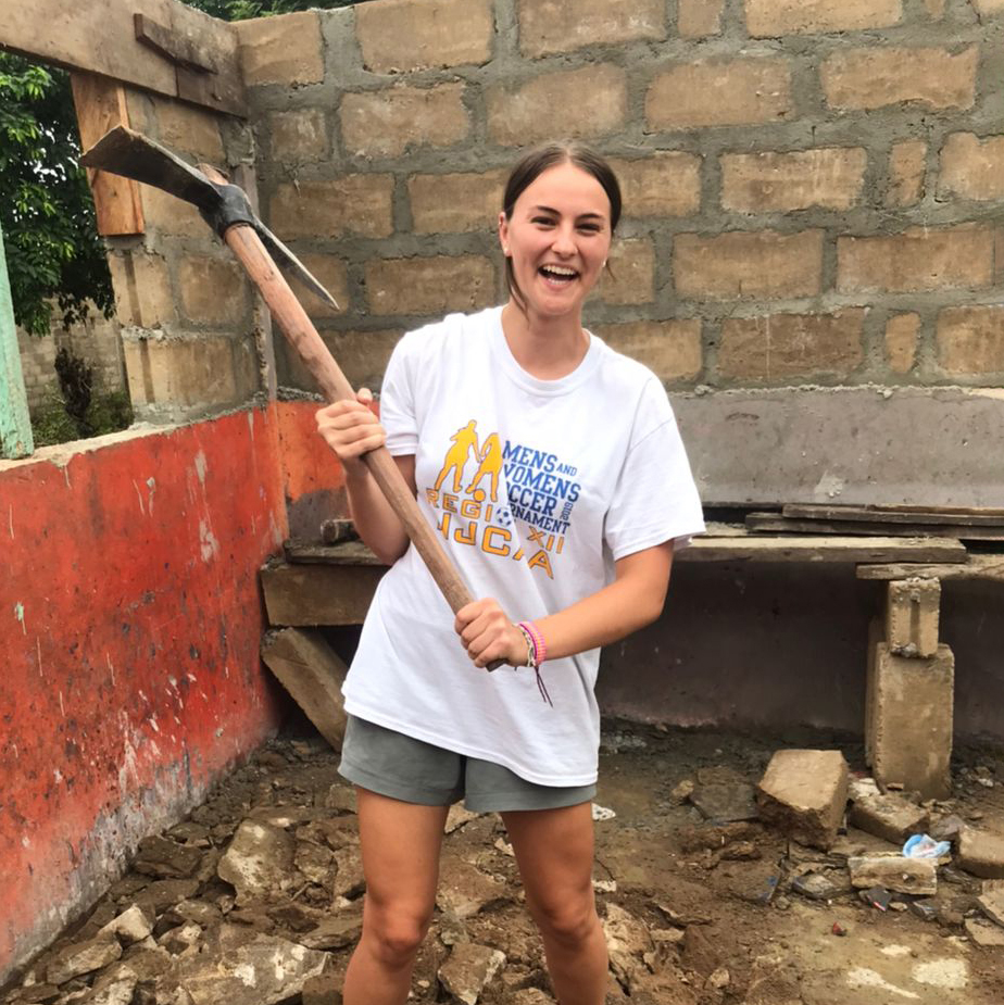 student volunteer working at orphanage