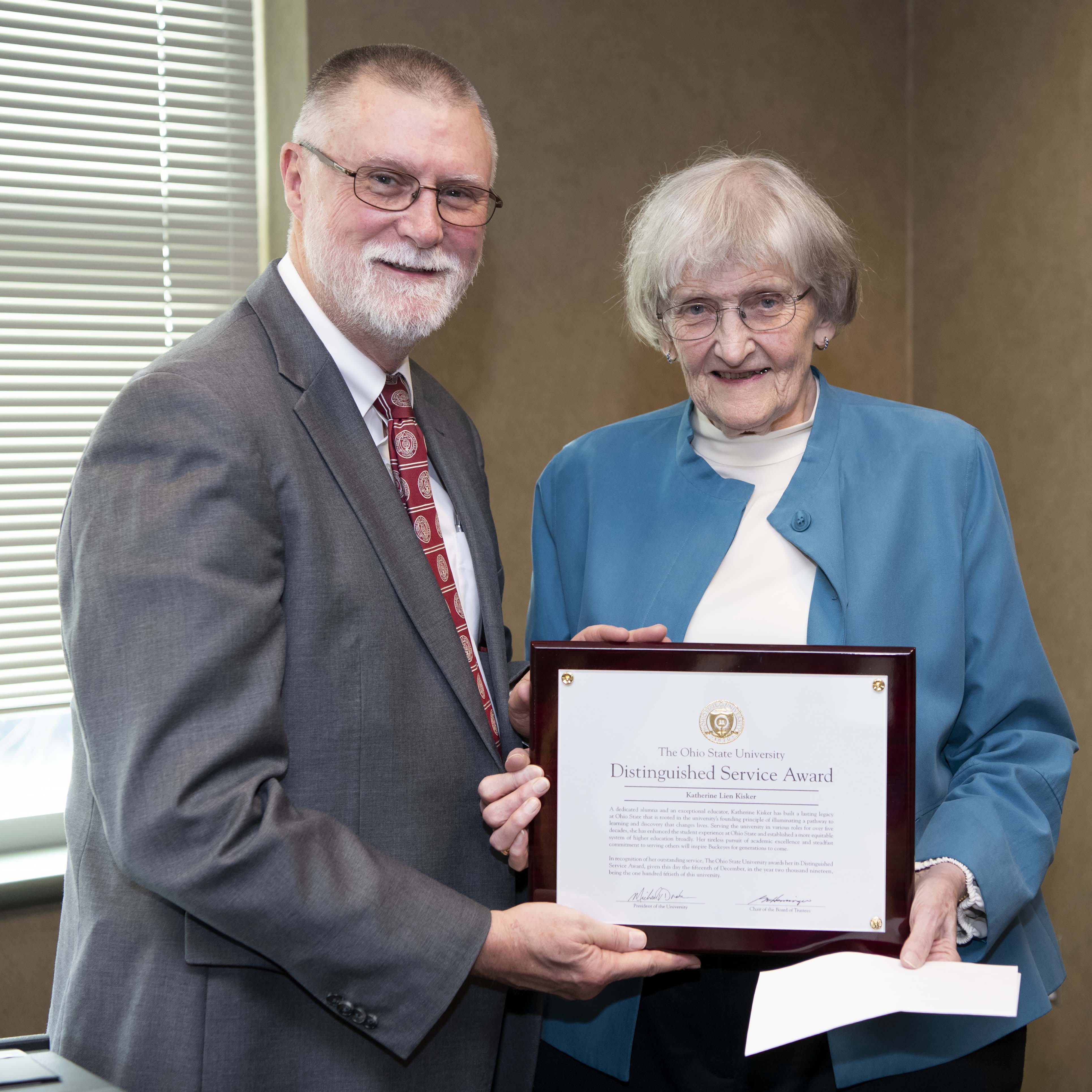 Kitty Kisker posing with Provost Bruce McPheron