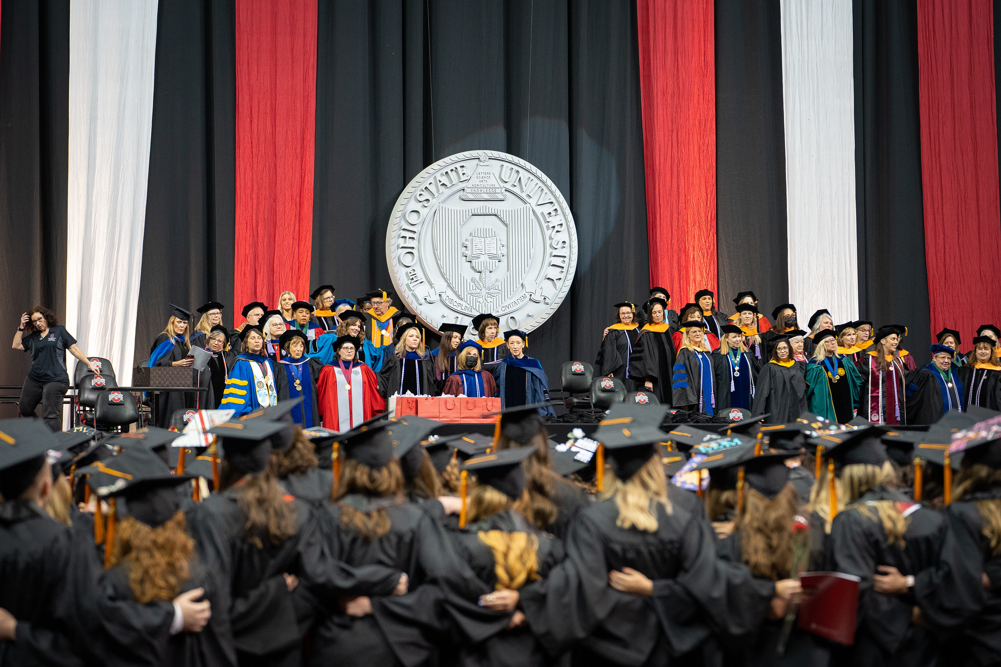 College of Nursing faculty and graduates singing Carmen Ohio at Convocation ceremony