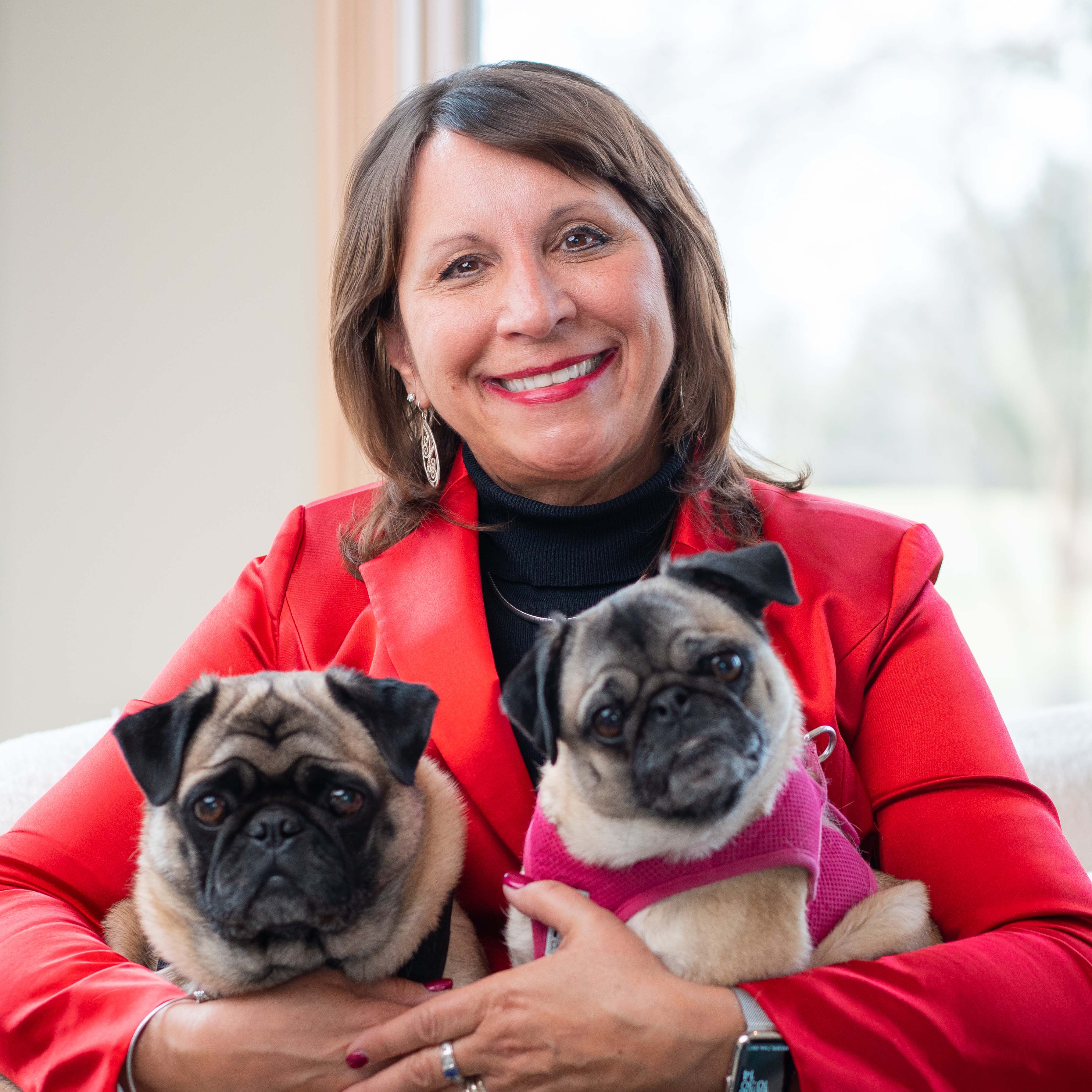Bern Melnyk holding her two dogs