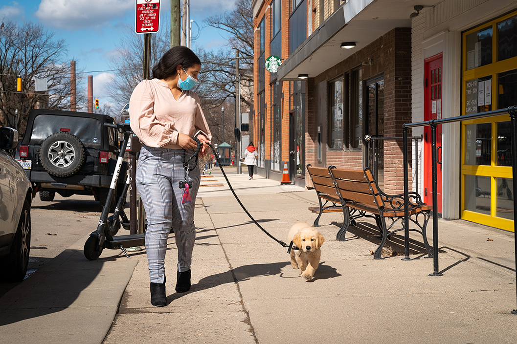 Adrienne walking a puppy down Neil Avenue