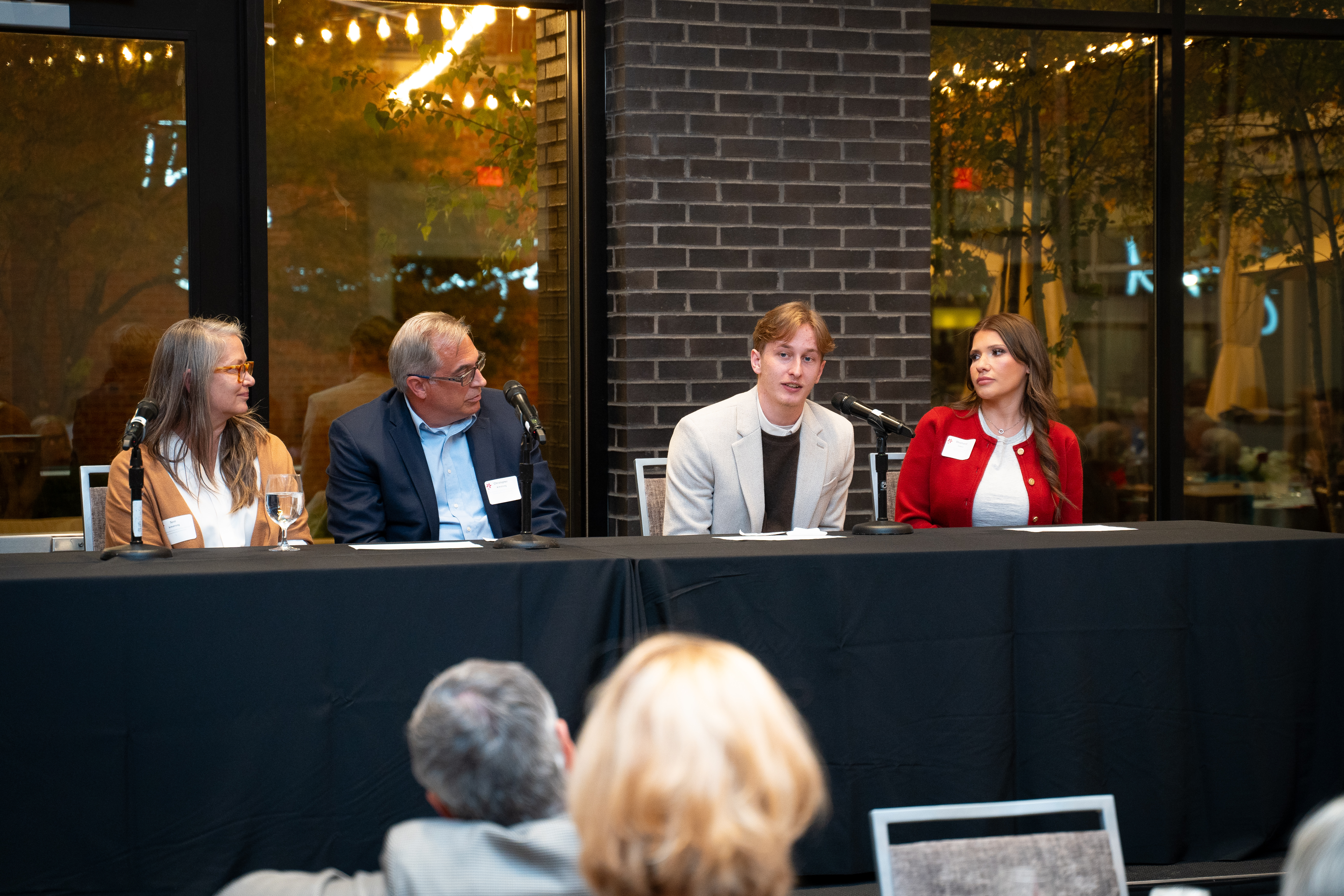 Cole serving on a panel discussion on how scholarship and philanthropy can empower future generations. Watching him on the left are donors Terri and Christopher Armstrong, who created the Donna Bovina Sanders and Mary Patricia Armstrong Nursing Scholarship that Cole was awarded.
