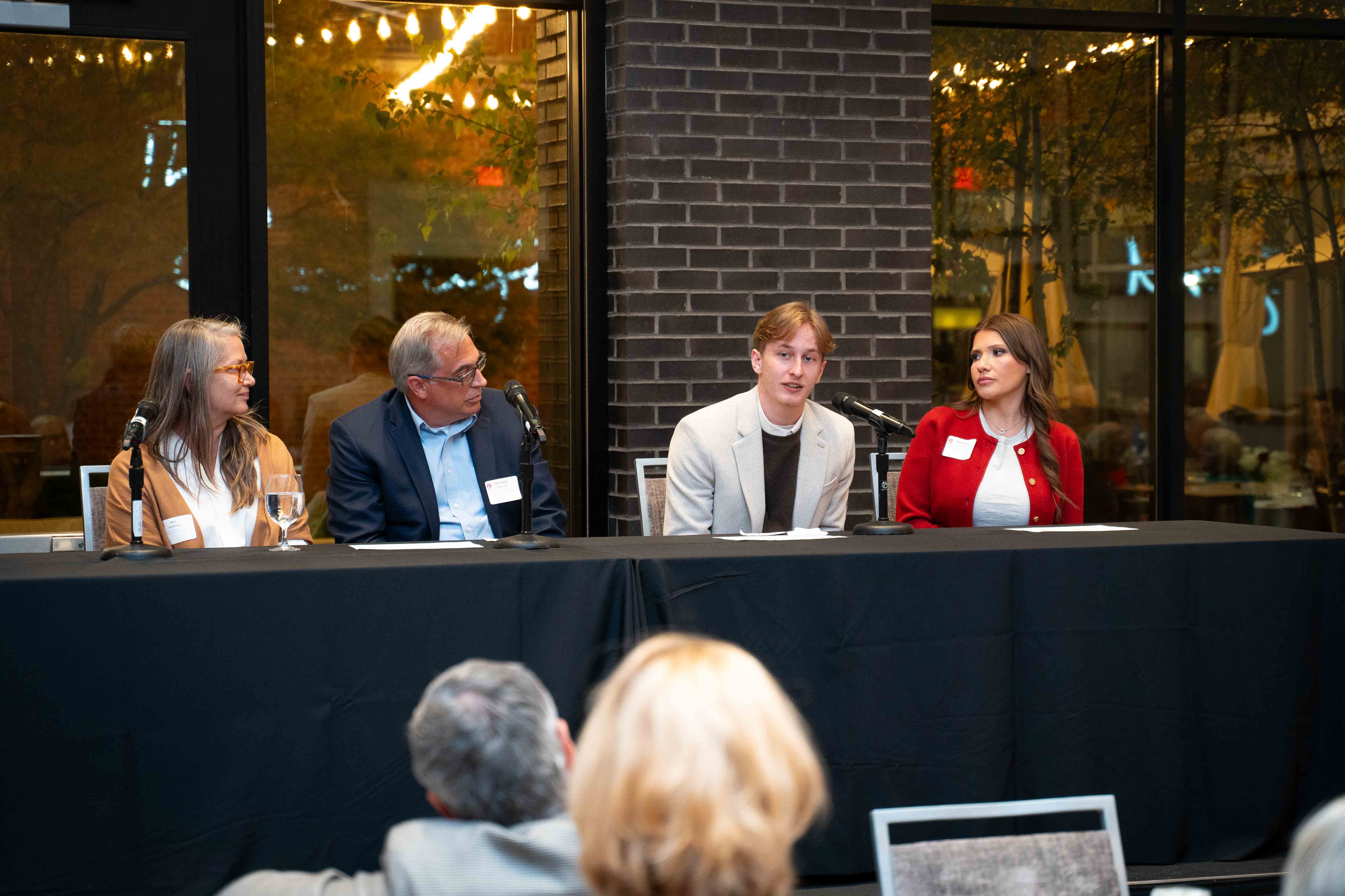 Cole serving on a panel discussion on how scholarship and philanthropy can empower future generations. Watching him on the left are donors Terri and Christopher Armstrong, who created the Donna Bovina Sanders and Mary Patricia Armstrong Nursing Scholarship that Cole was awarded.