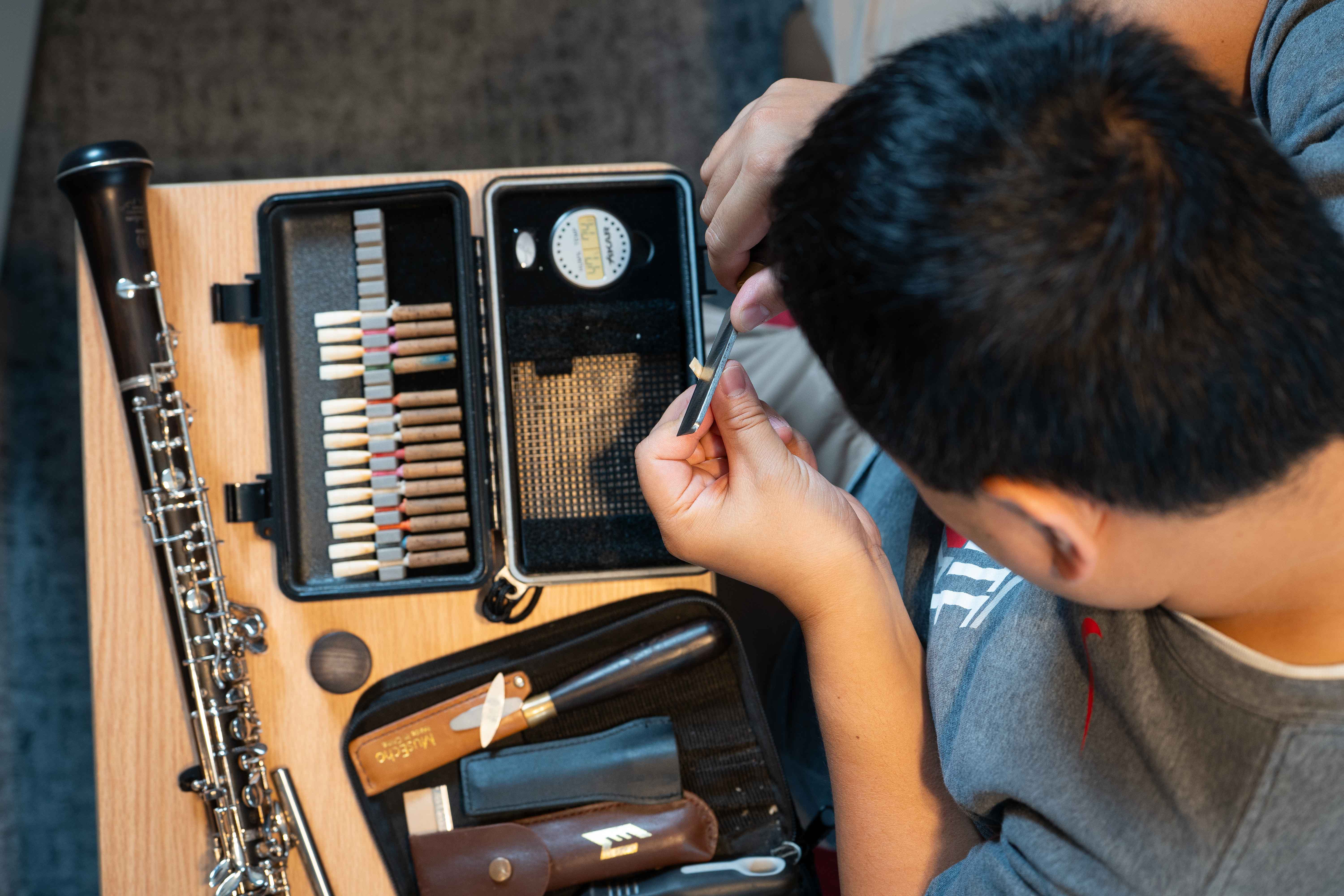 Chris Connors demonstrates how to fashion an oboe reed