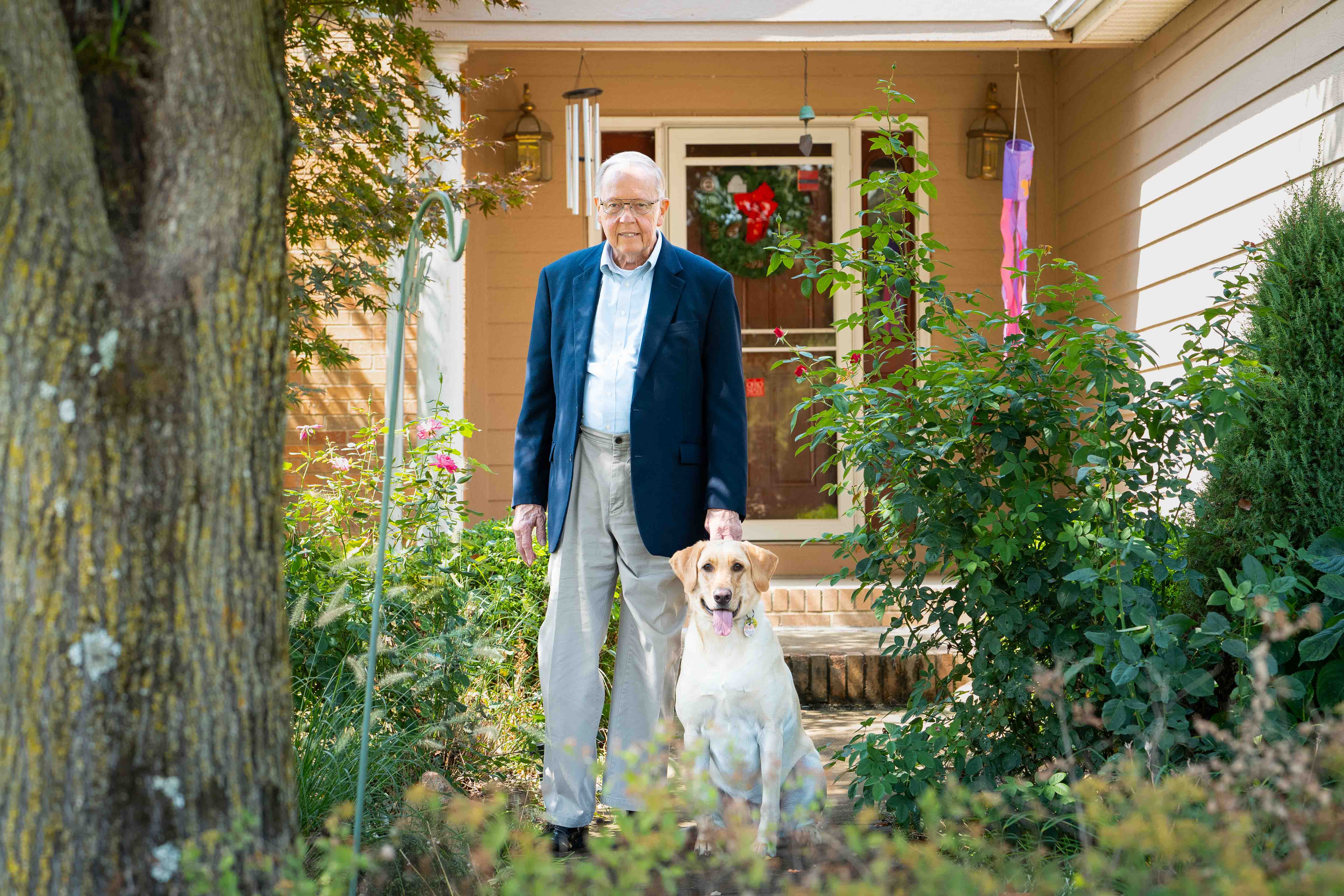 David Hiatt at home with his dog