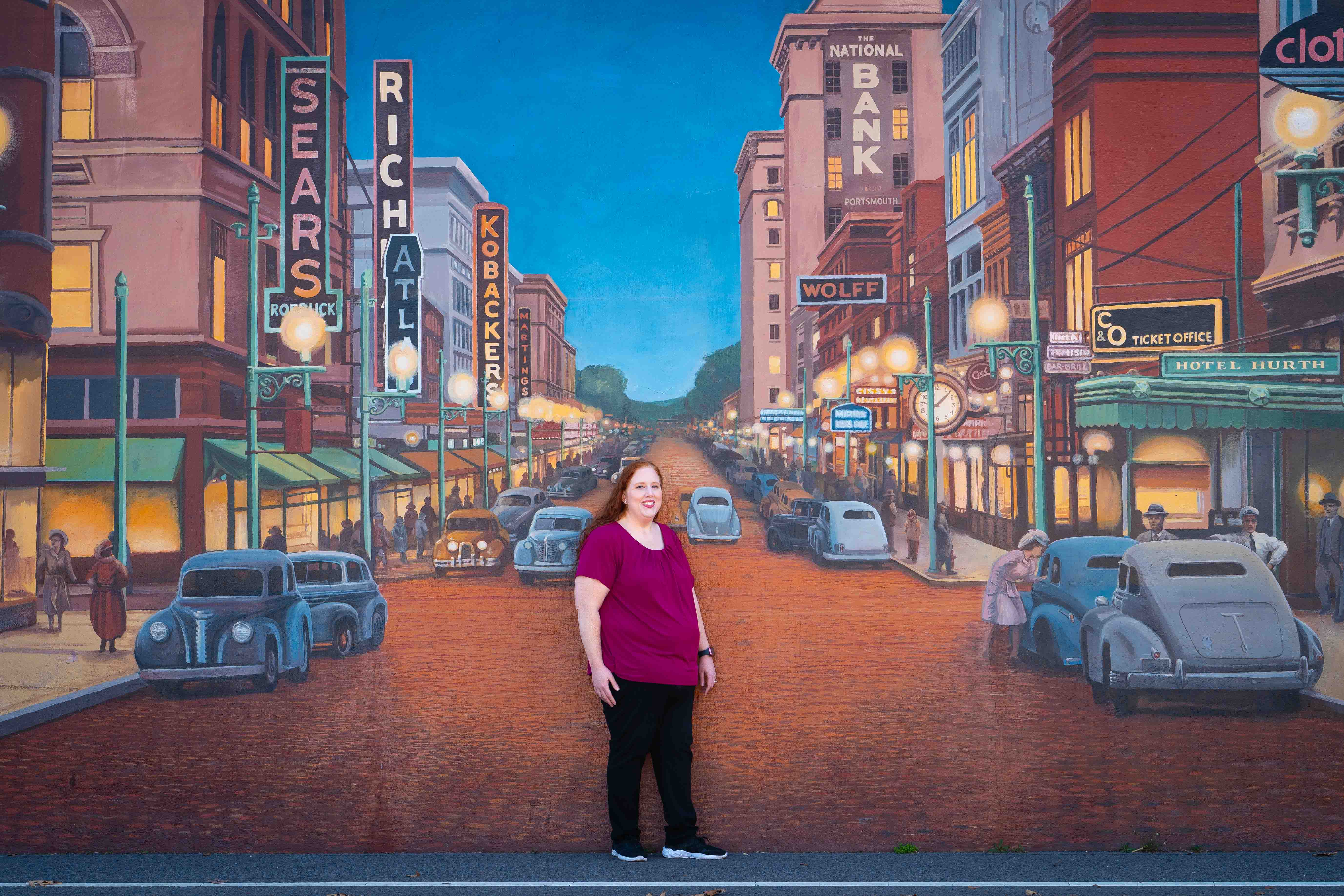 Angela Occidental in front of the Portsmouth Floodwall Mural