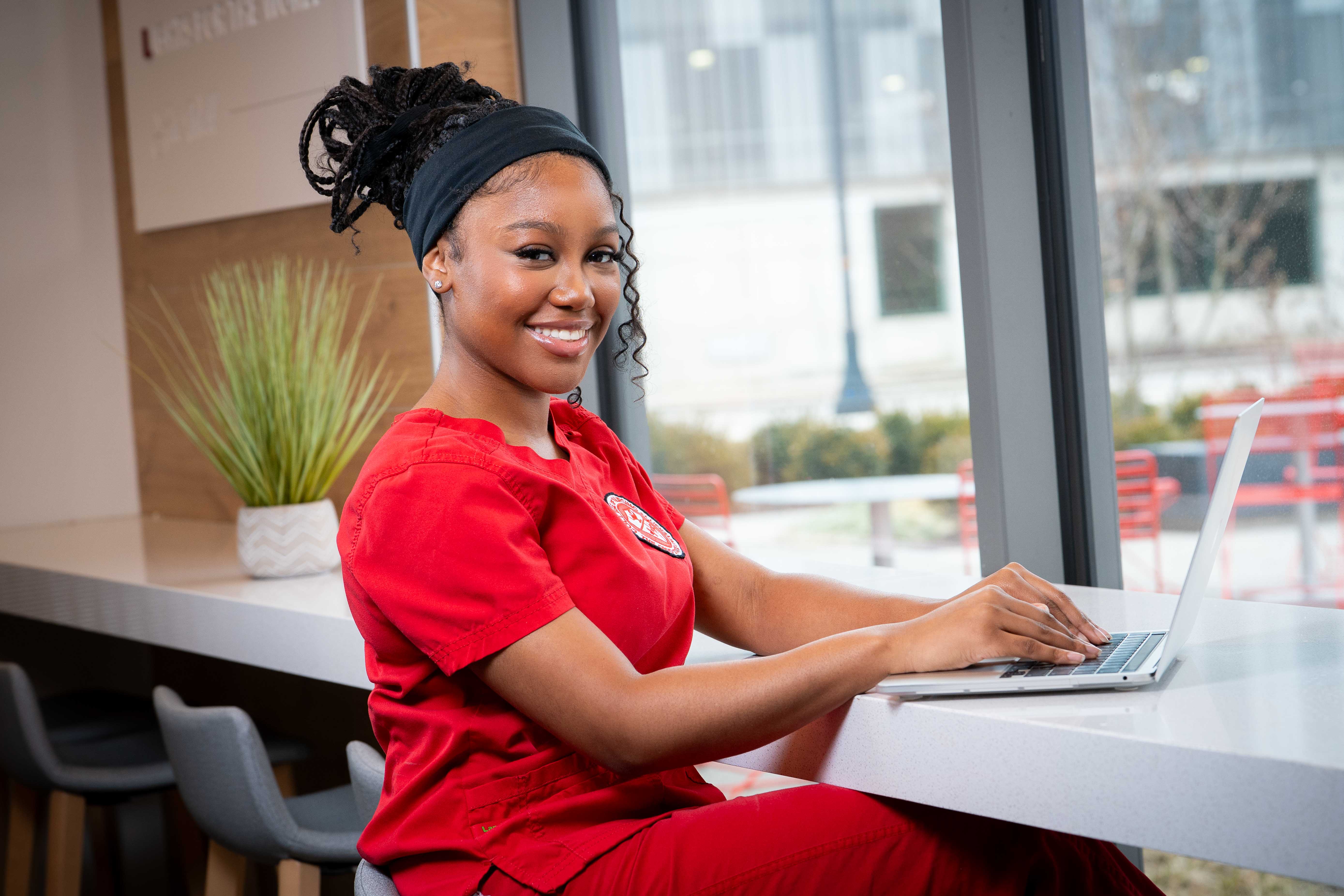 Briana Gordon studying on her computer in Heminger Hall.