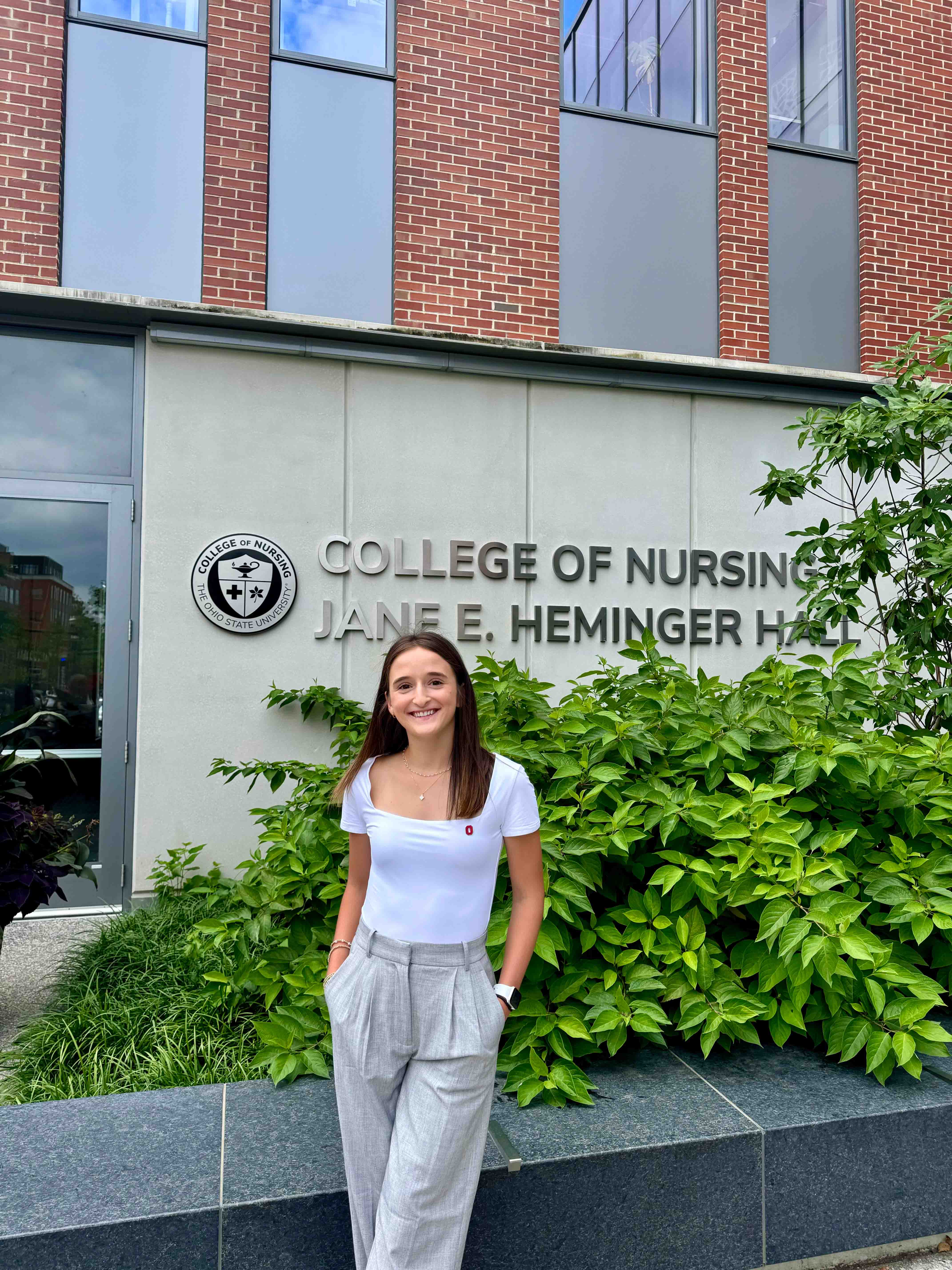 ashley poses in front of heminger hall