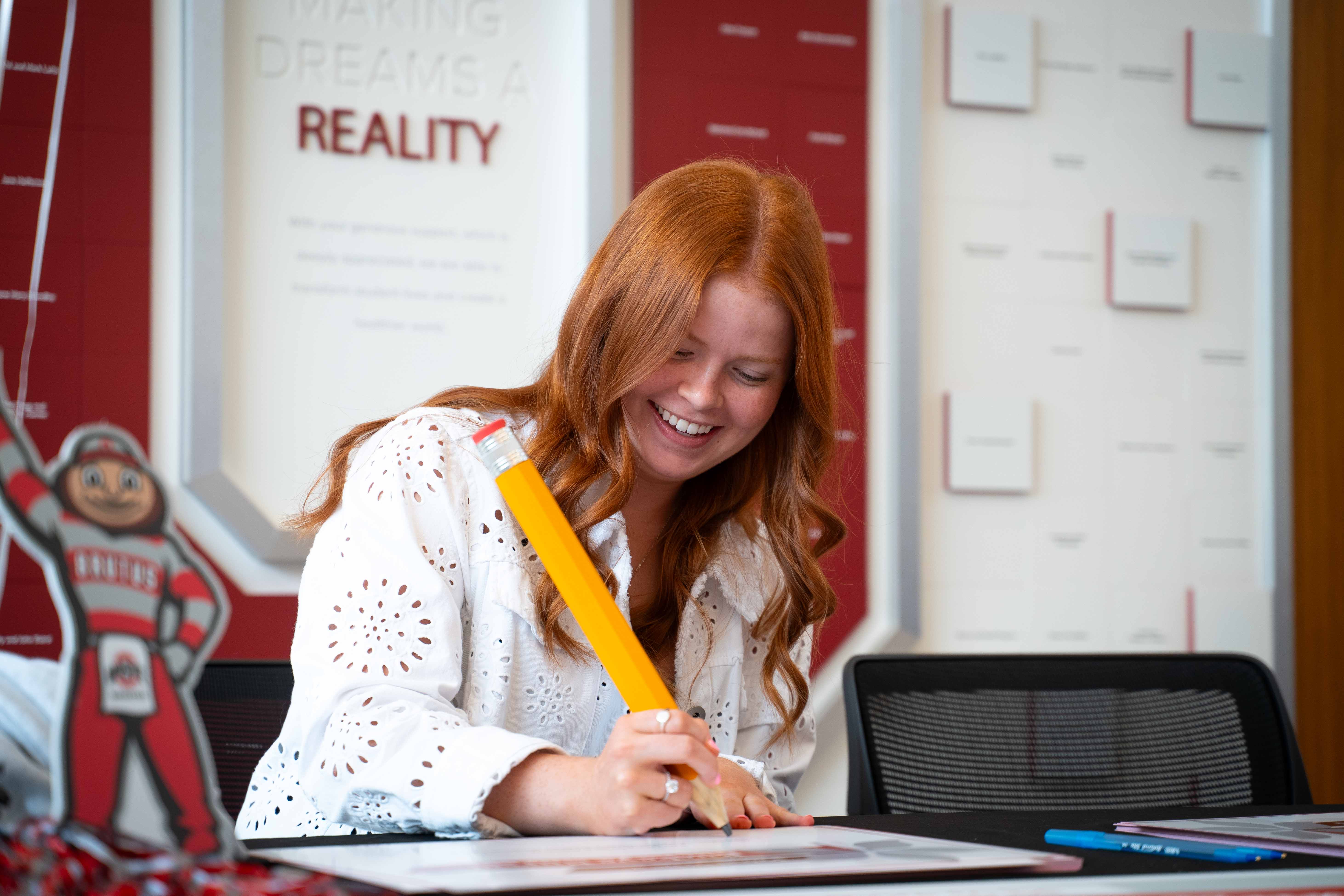 Hannah Henry with giant pencil