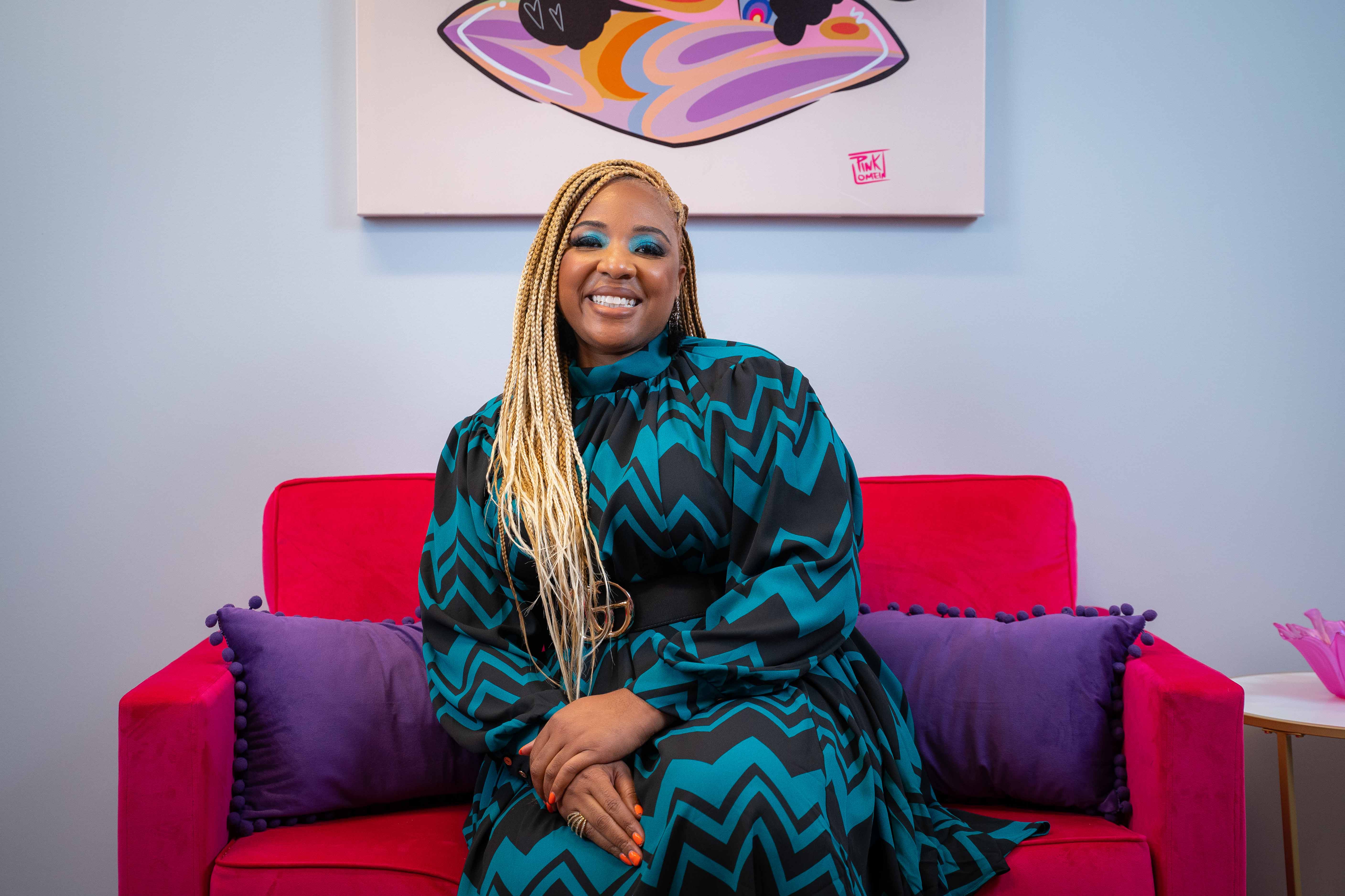 Da'na Langford on a couch in her office