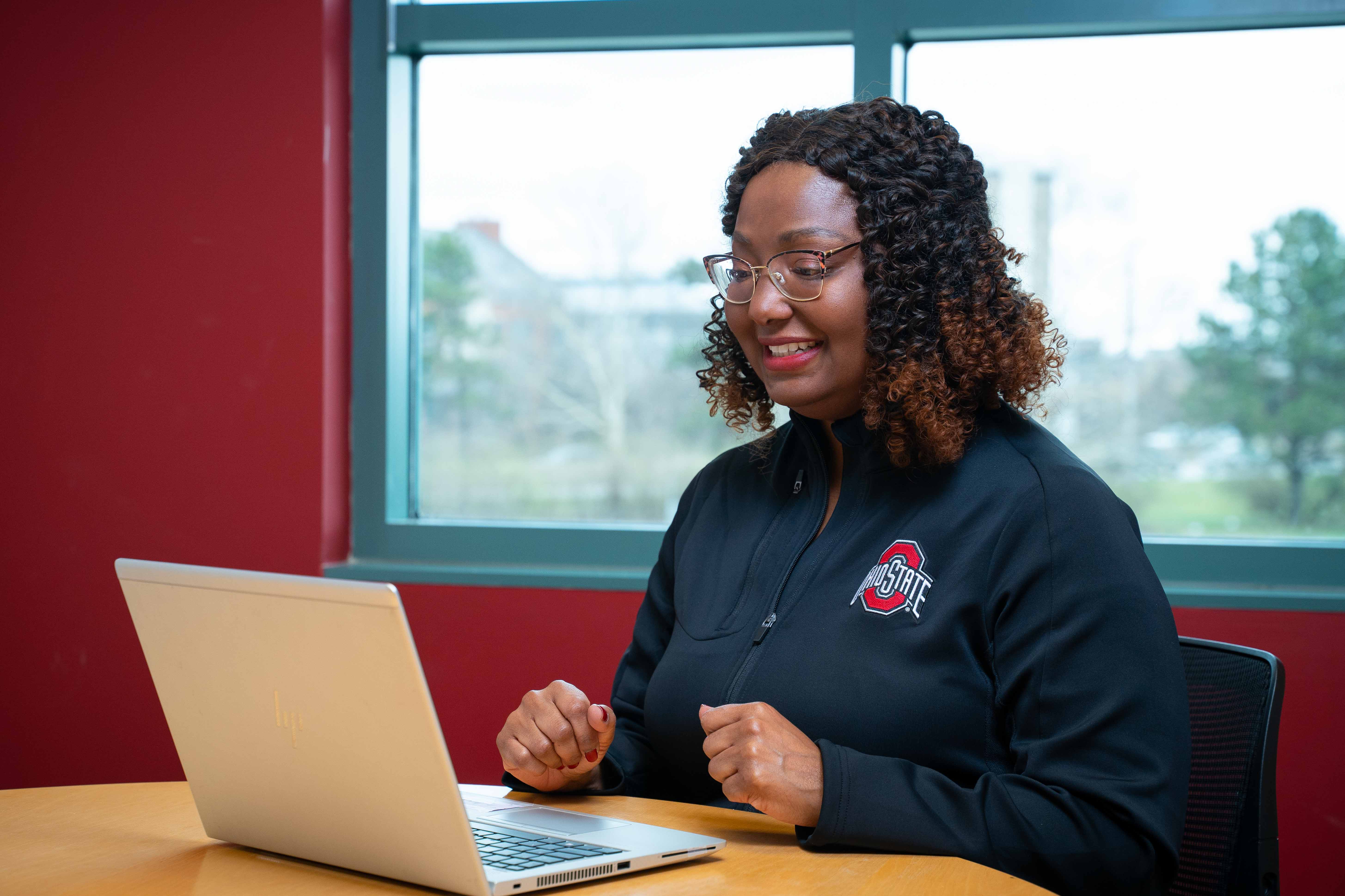 Kathy Wright sitting at computer