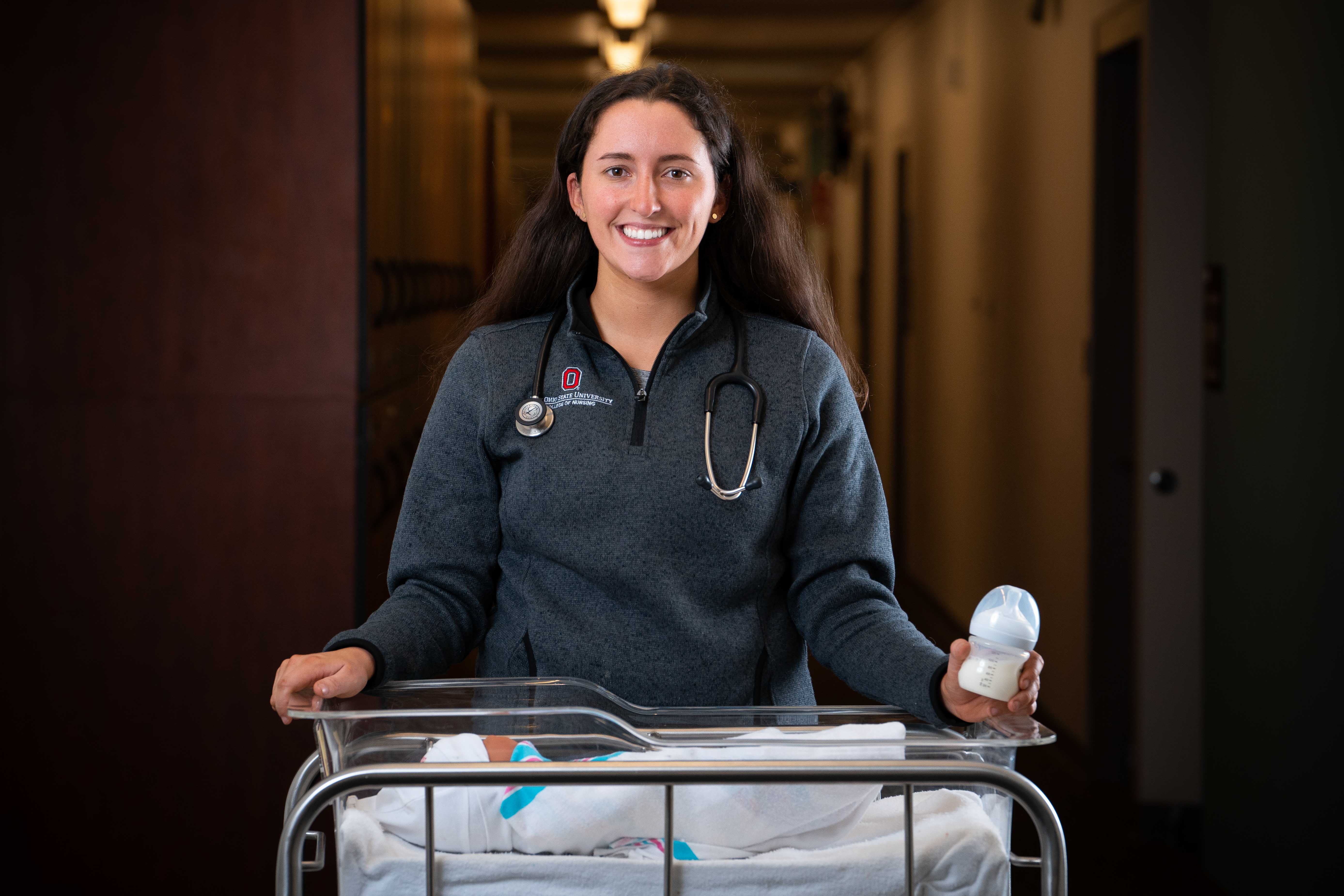 Audrey Robinson holding a milk bottle