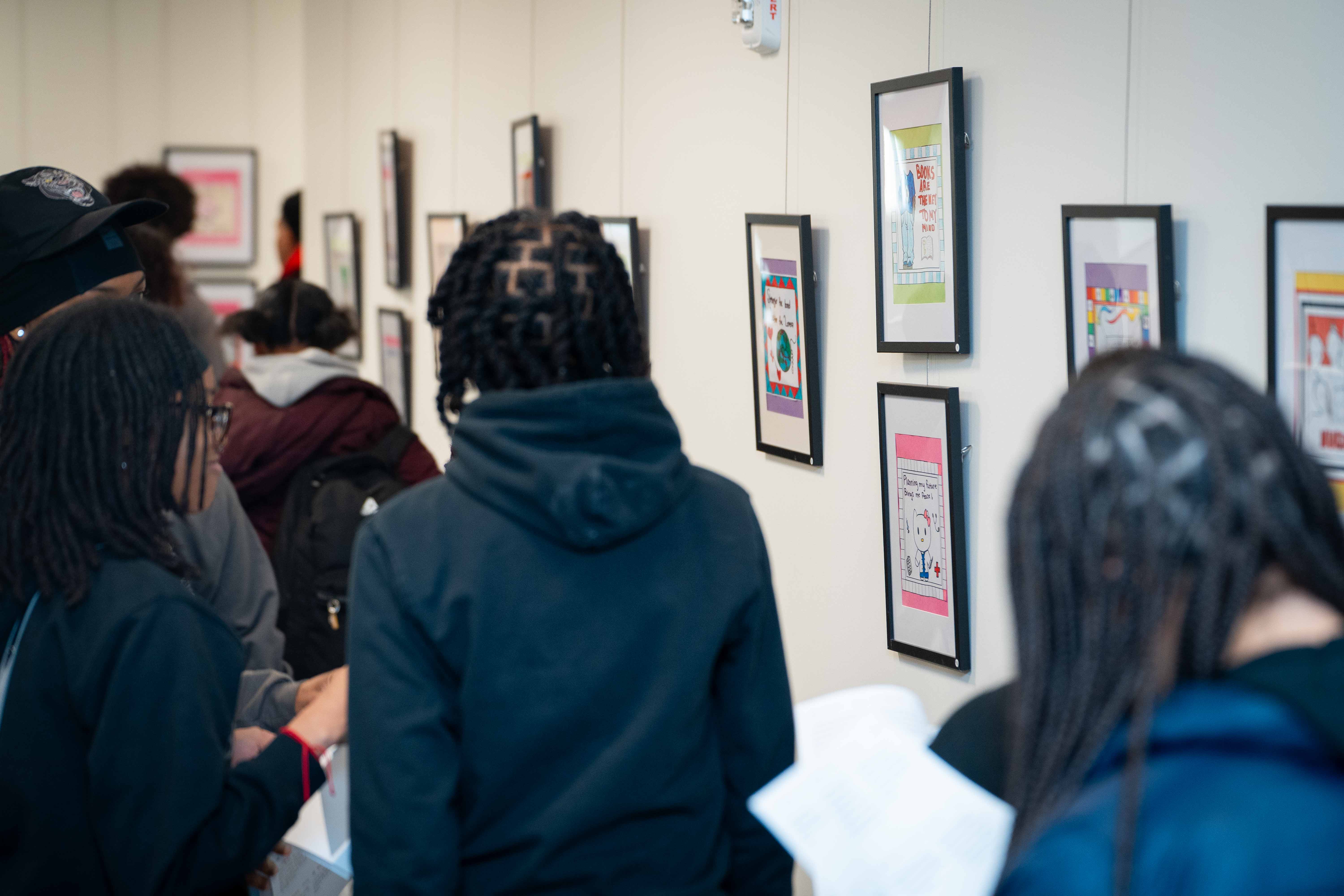 Students looking at art installation