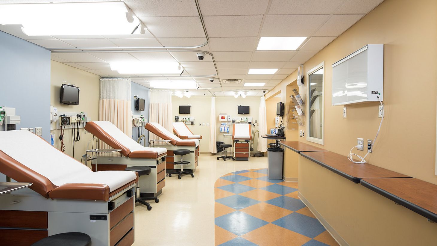 simulation room with multiple patient beds and monitoring equipment