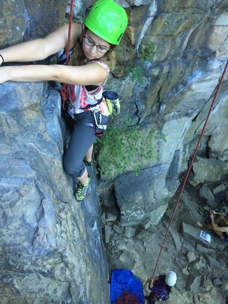 Kate Best rock climbing