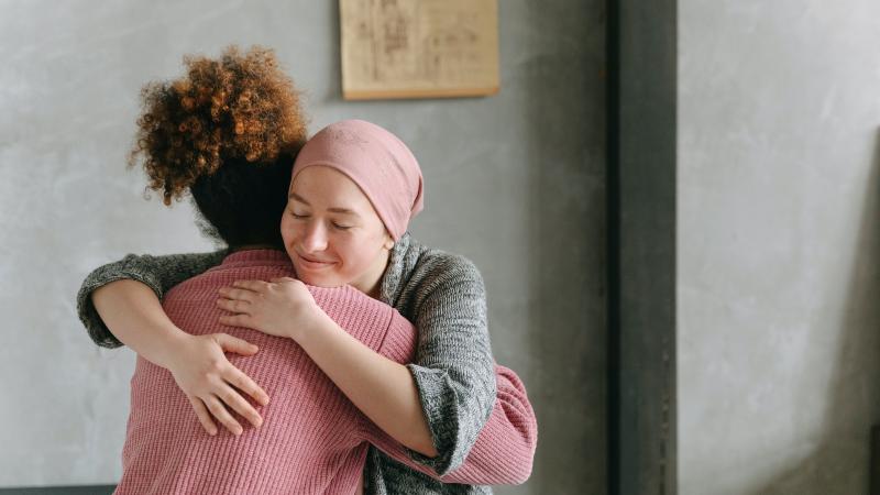 cancer patient hugging caregiver