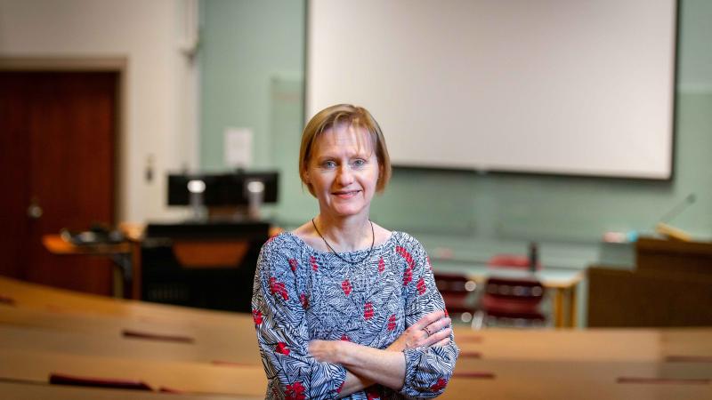 Joni Tornwall standing in a lecture hall