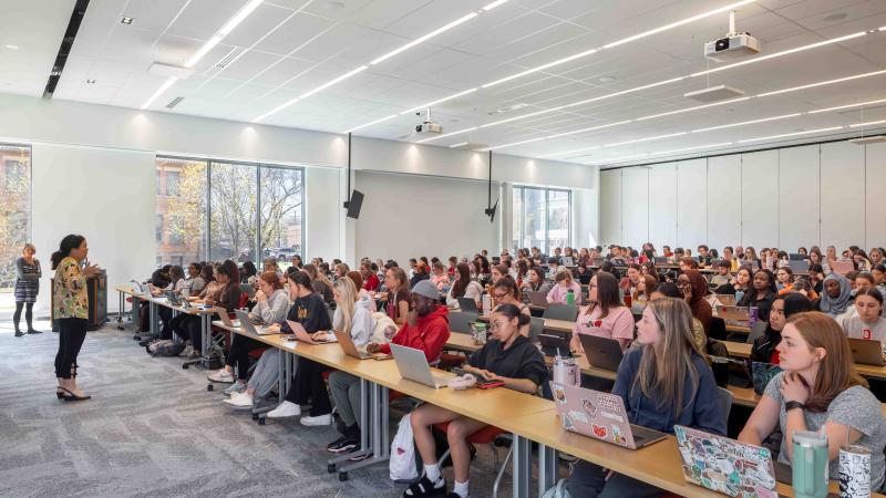 Photography ©️Brad Feinknopf professor lecturing a classroom full of students 