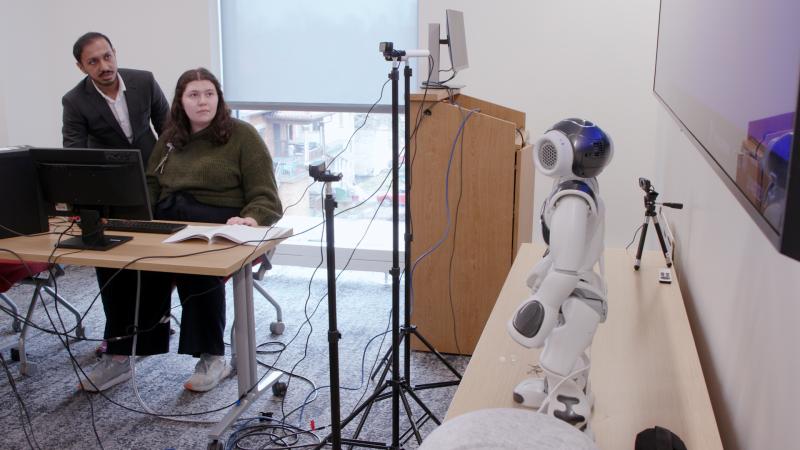 engineers testing robot