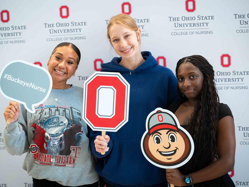 nursing students pose with Ohio State props