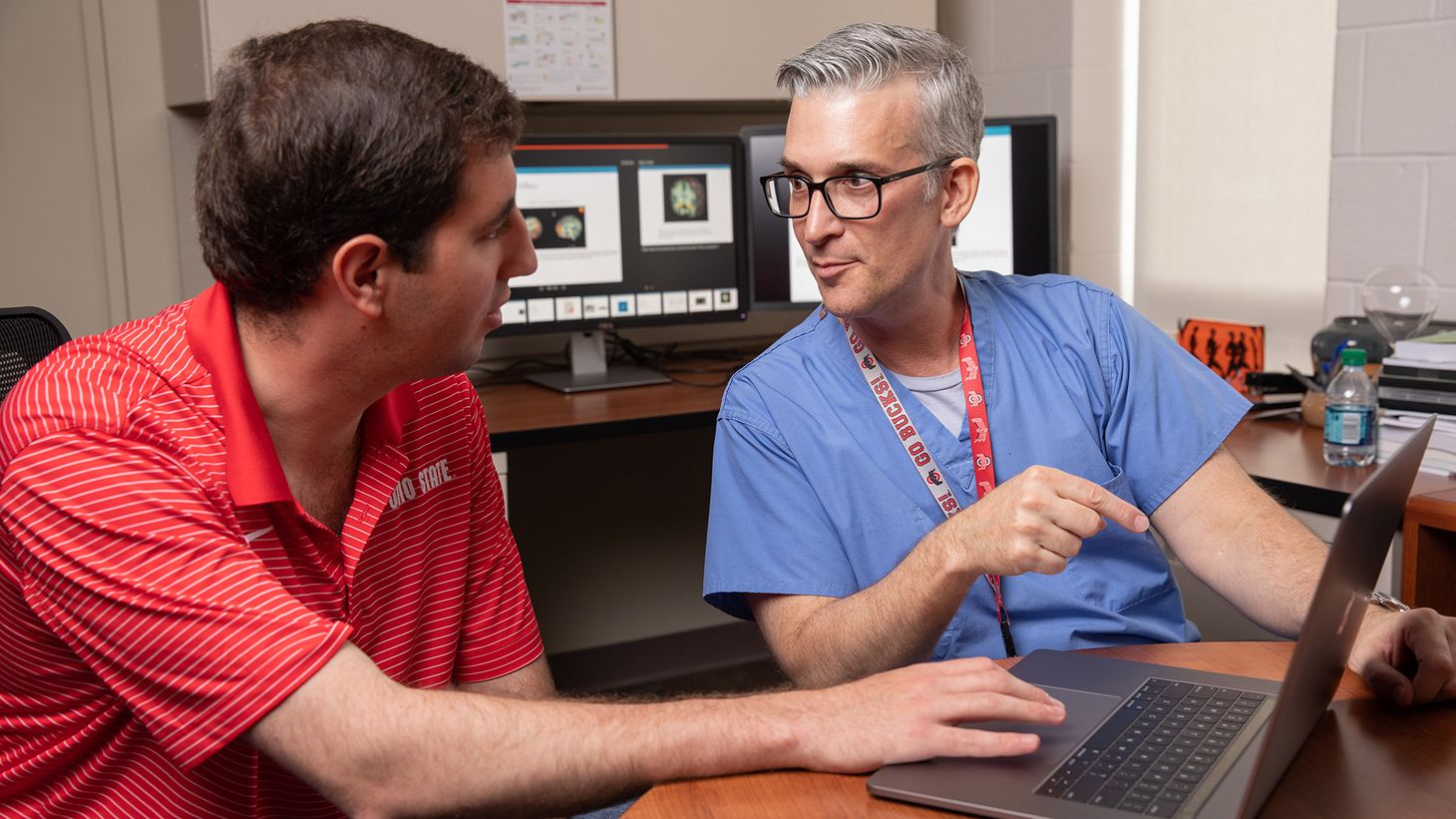 Nurse showing someone data on a screen