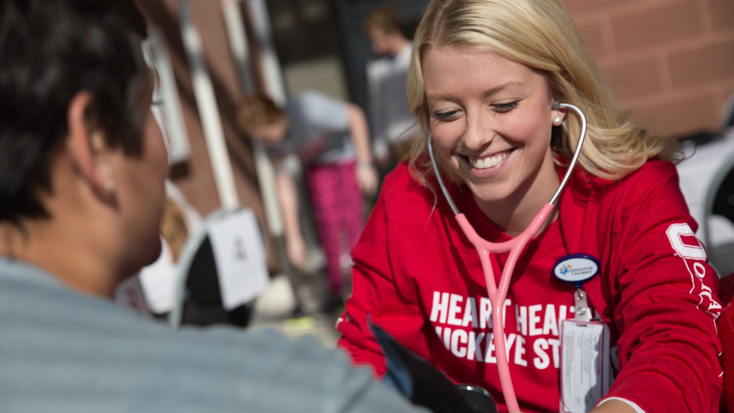 nursing student checking blood pressure