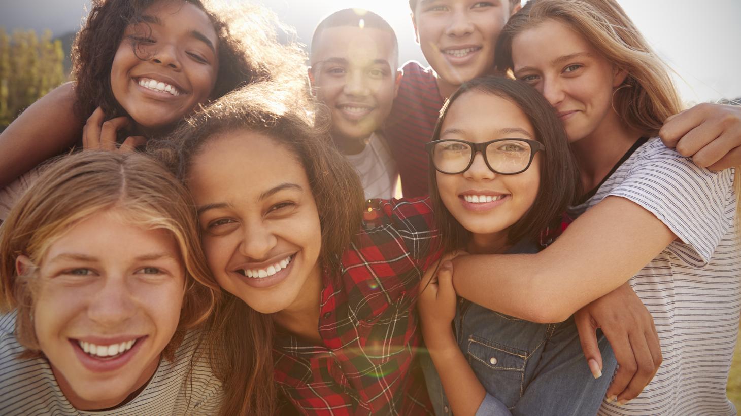 group of adolescents smiling