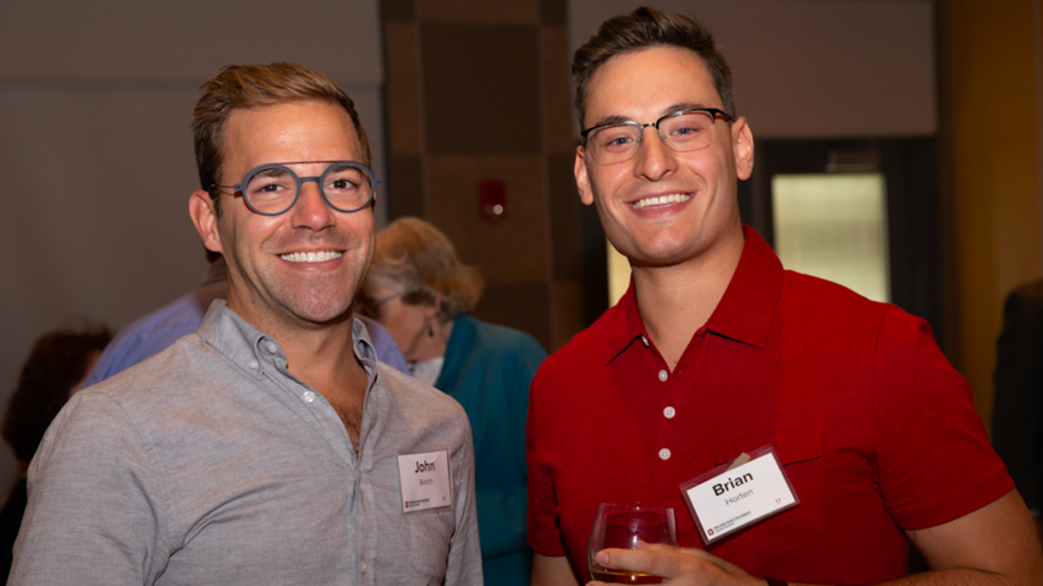 two alumnus at our wine tasting event