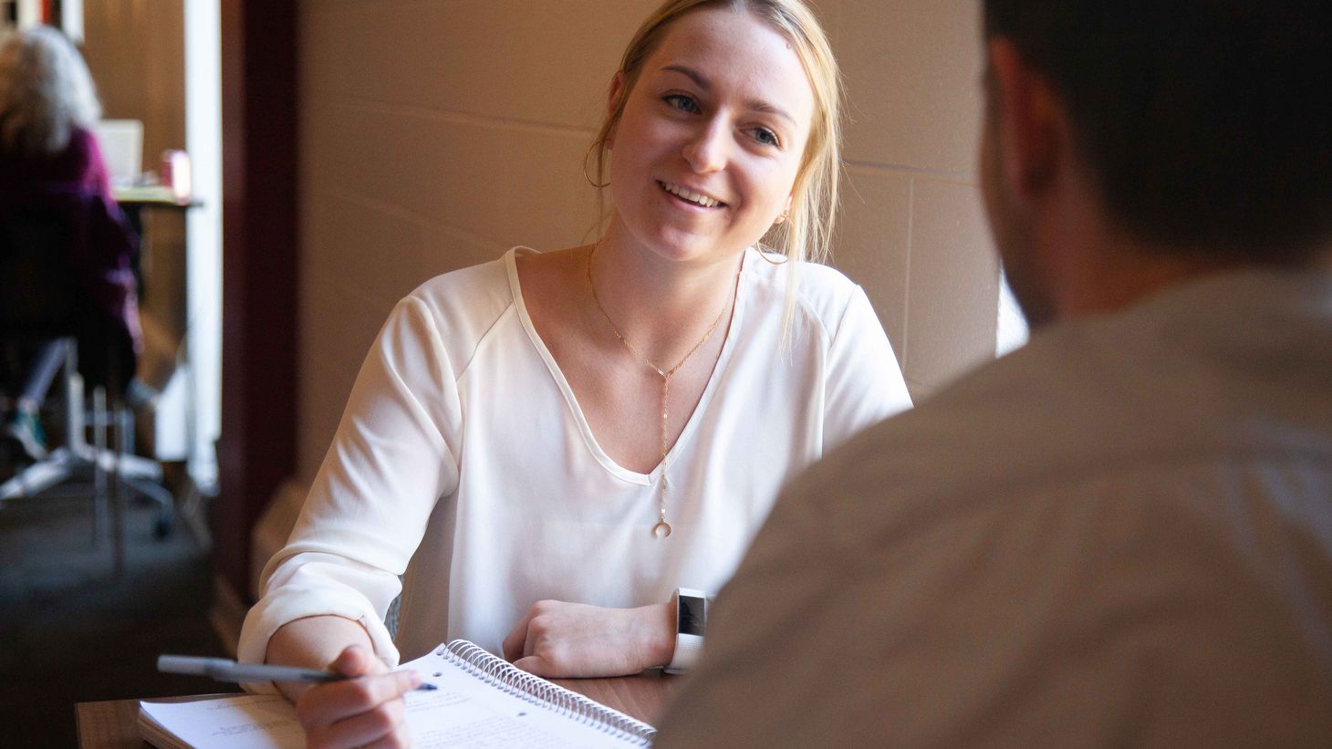student talking with instructor