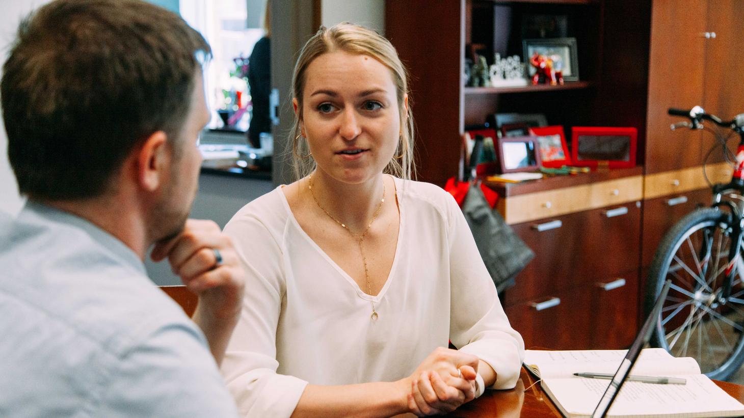 student talking with instructor