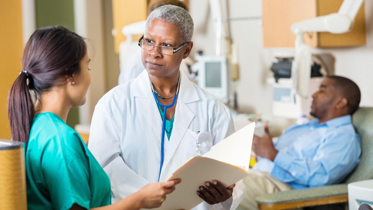 nurses talking to each other in a hospital