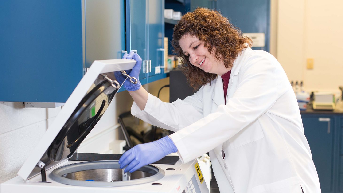 PhD student working with lab equipment 