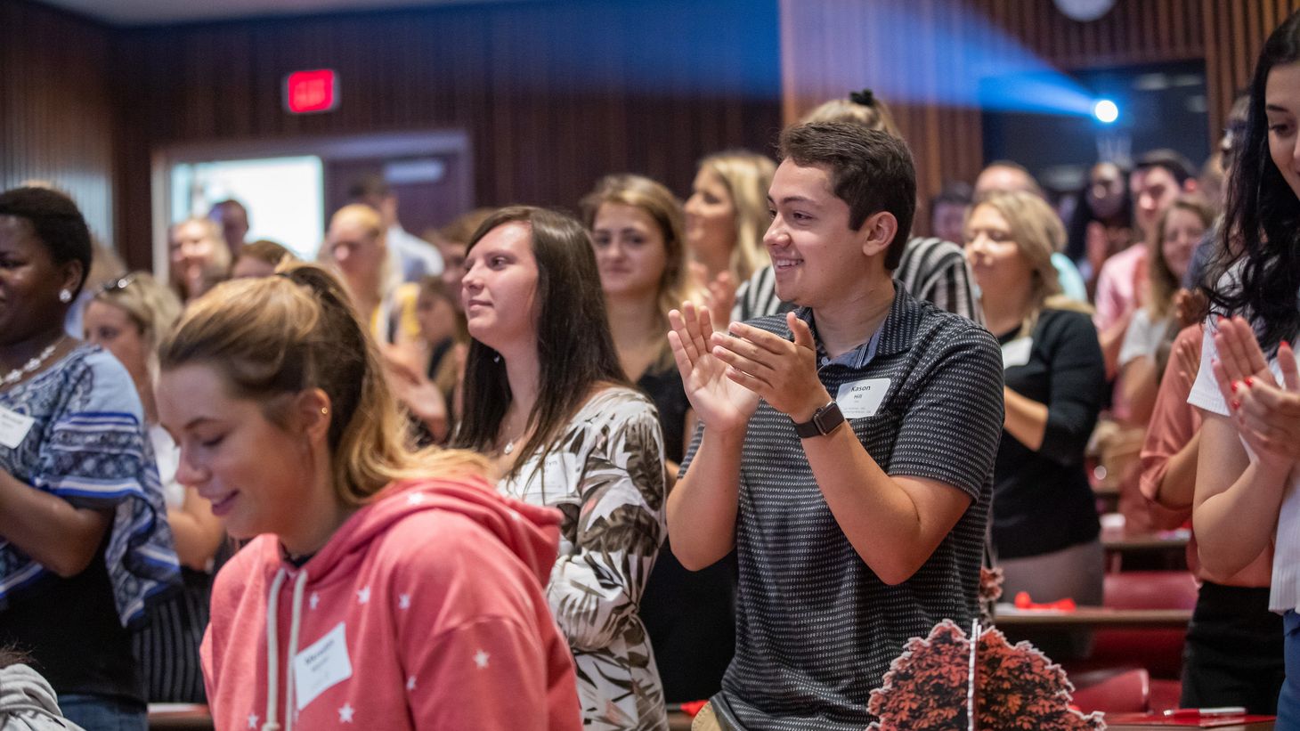 students clapping in classroom