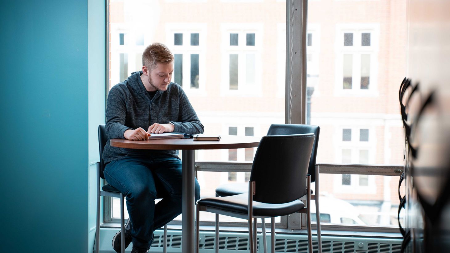 student studying in hallway