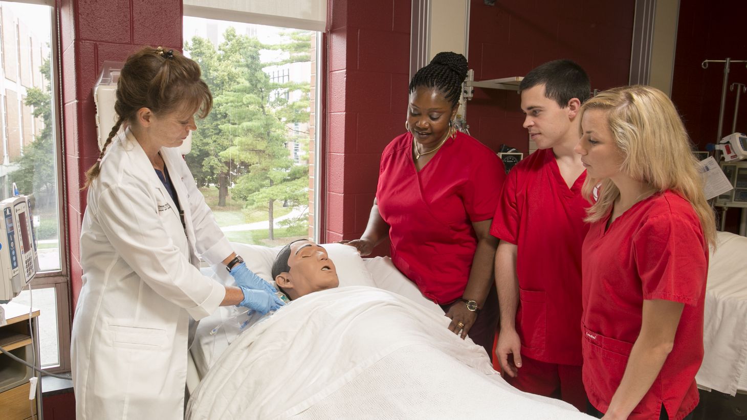 diverse nursing students with instructor