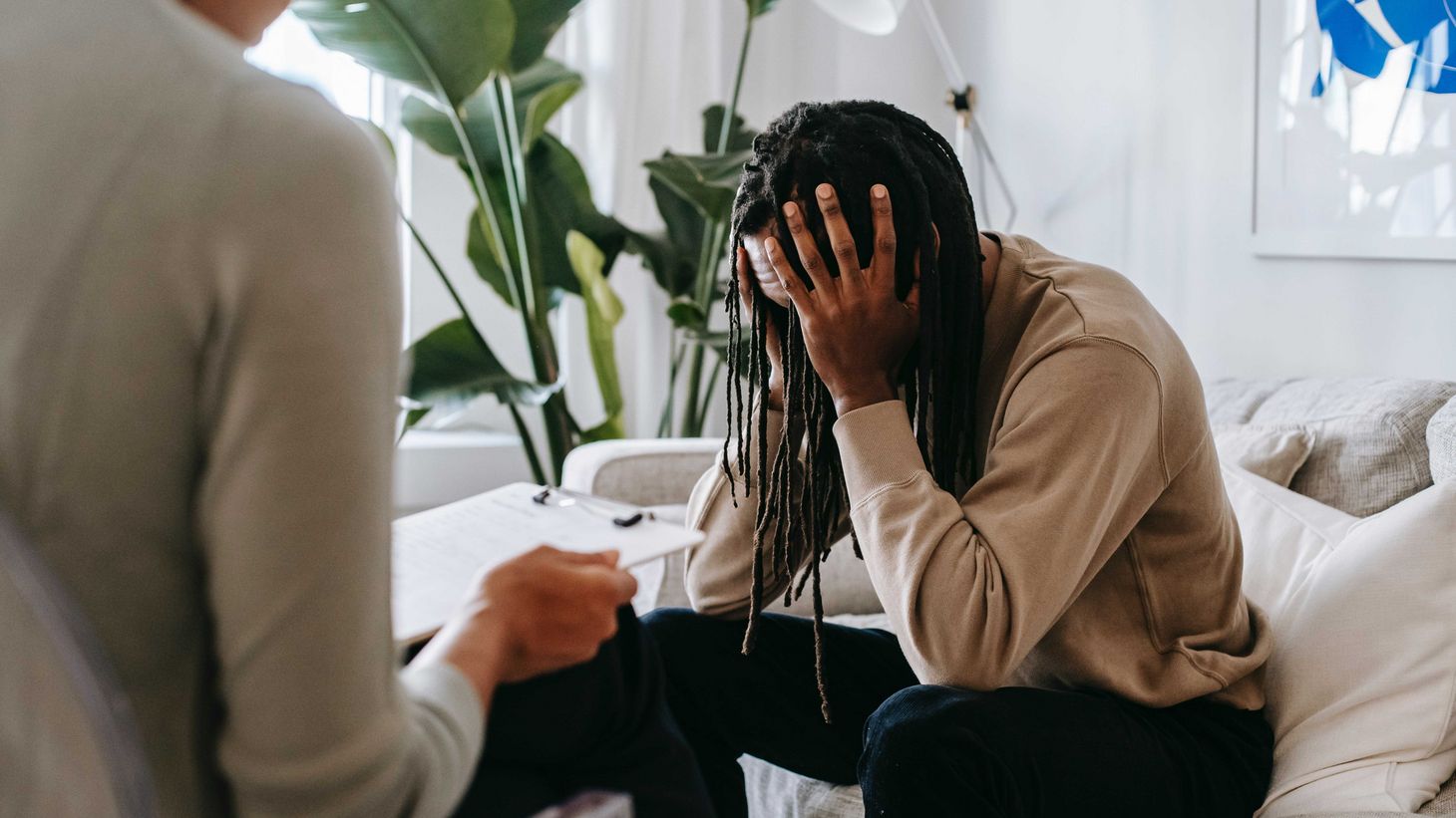 Stressed black man with dreadlocks in psychological office | Photo by Alex Green from Pexels