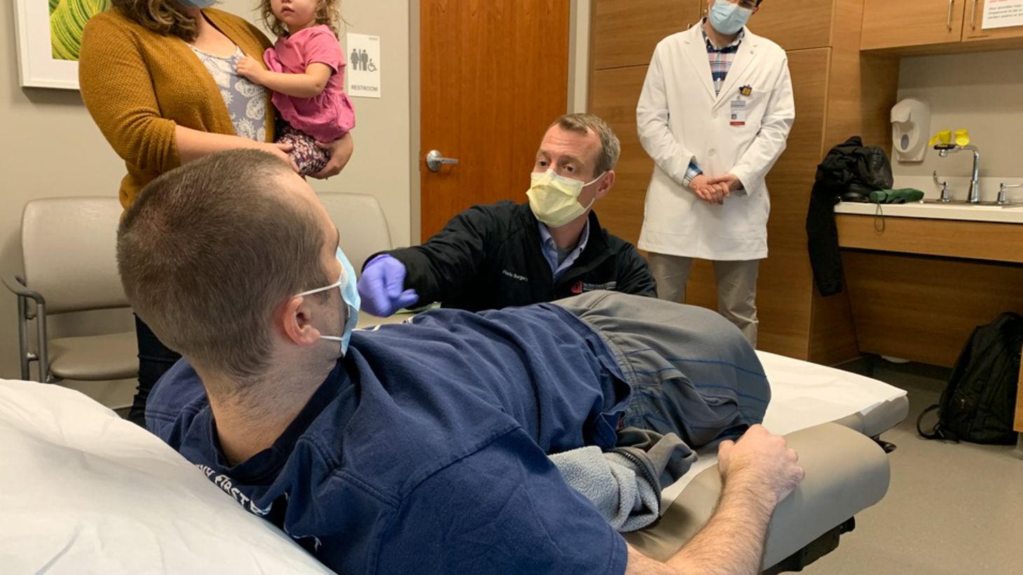 Dr. Jason Souza examines Nick Vogt at The Ohio State University Wexner Medical Center to assess his recovery after surgery