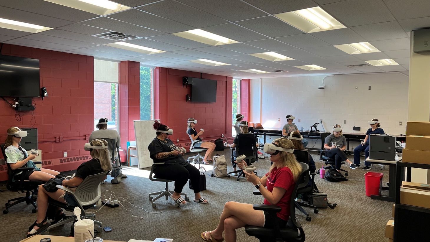 Students working with XR/VR technology