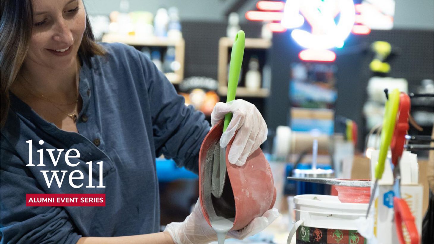 woman pouring a mold.